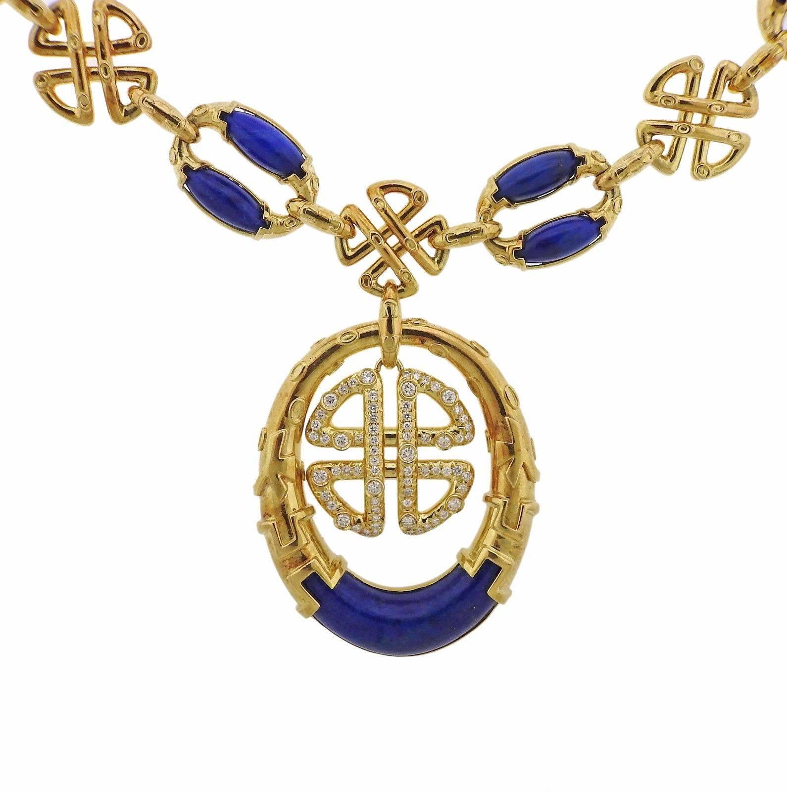 An 18k yellow gold necklace set with lapis and approximately 1.64ctw of H/VS-SI diamonds.  The necklace measures 23" long and the pendant is 70mm x 43mm.  The weight of the piece is 138.3 grams. Marked: 750, NM.