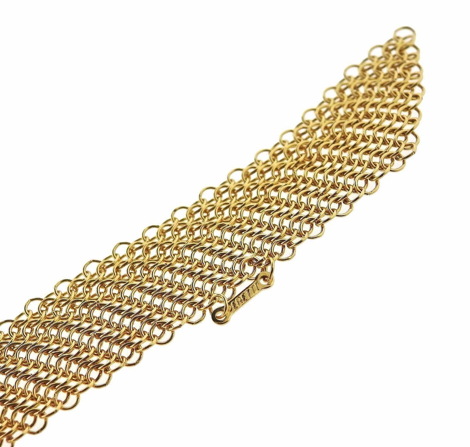 An 18k yellow gold necklace by Elsa Peretti for Tiffany & Co.  The necklace is 31" long and 16mm wide.  The weight of the piece is 63.6 grams.  Marked: Peretti, T & Co, 750.