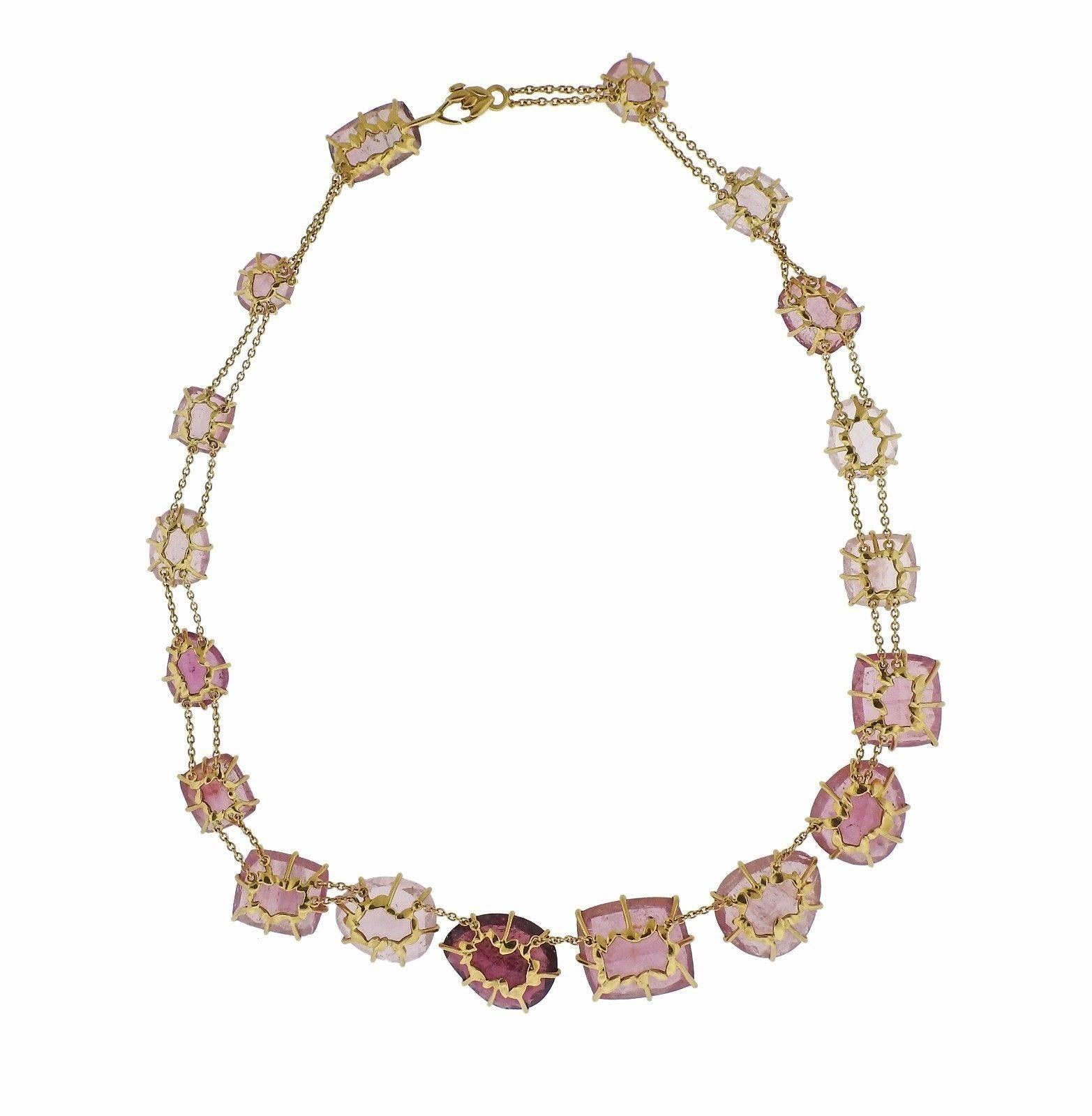 An 18k yellow gold necklace set with pink tourmalines.  The necklace is 16 1/4