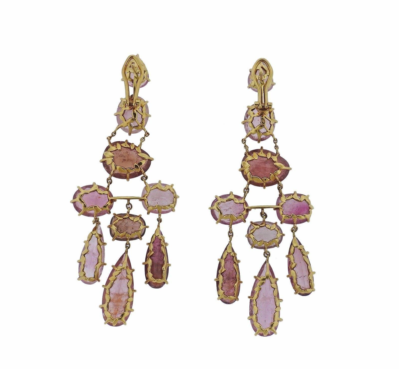 A pair of 18k yellow gold earrings set with pink tourmalines. Earrings are 75mm long x 28mm wide.  The weight of the pair is 20.5 grams.  Marked: Signature S and Star marks, 750.