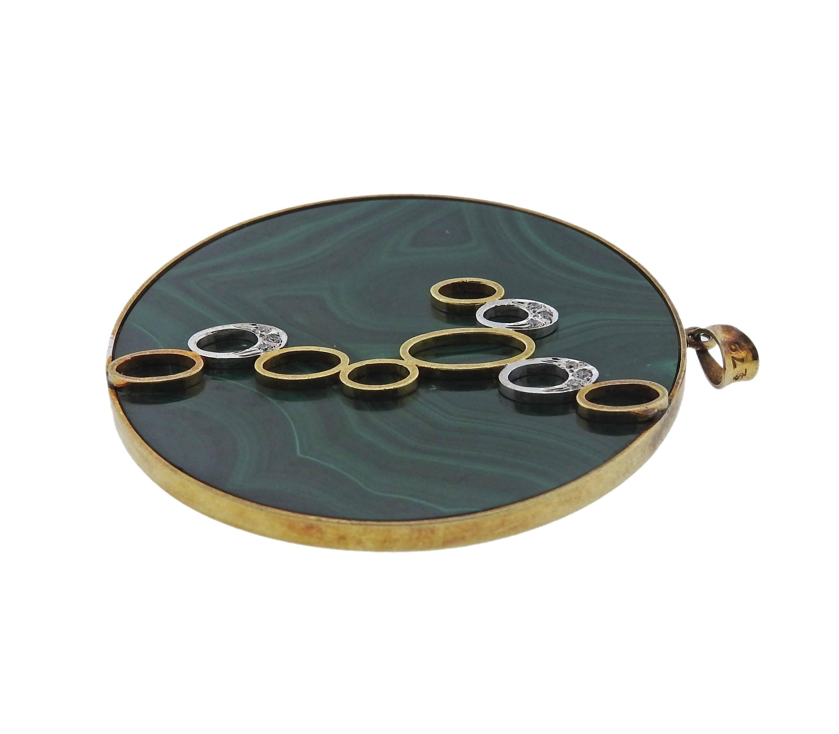 14k yellow gold circle pendant, set with malachite and approx. 0.06ctw in diamonds. Pendant is 50mm in diameter and weighs 30.5 grams. Marked: 14k 585 