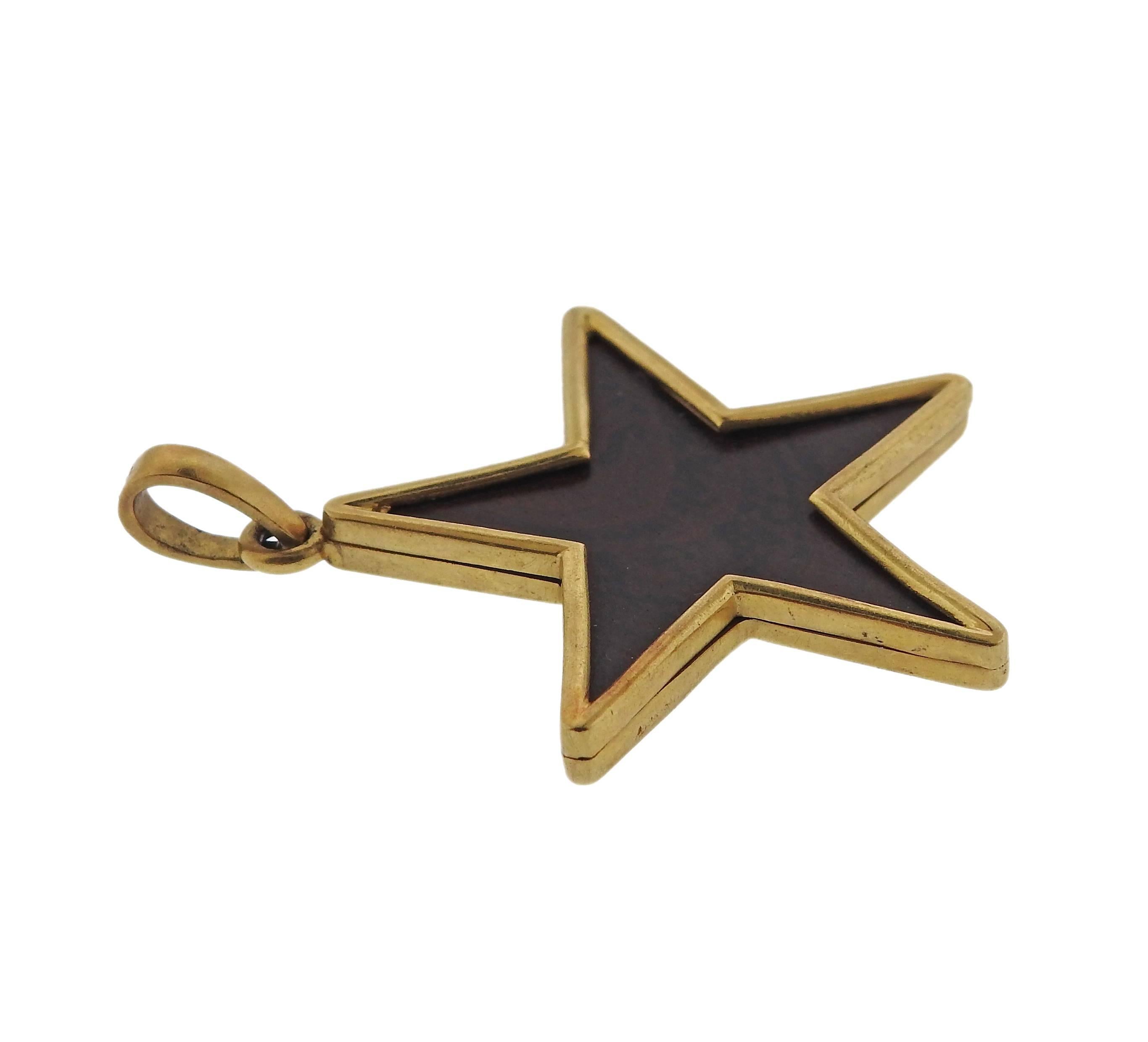 Vintage 18k gold star pendant, set with ebony wood. Pendant is 48mm x 37mm and weighs 8.2 grams. Marked 750.