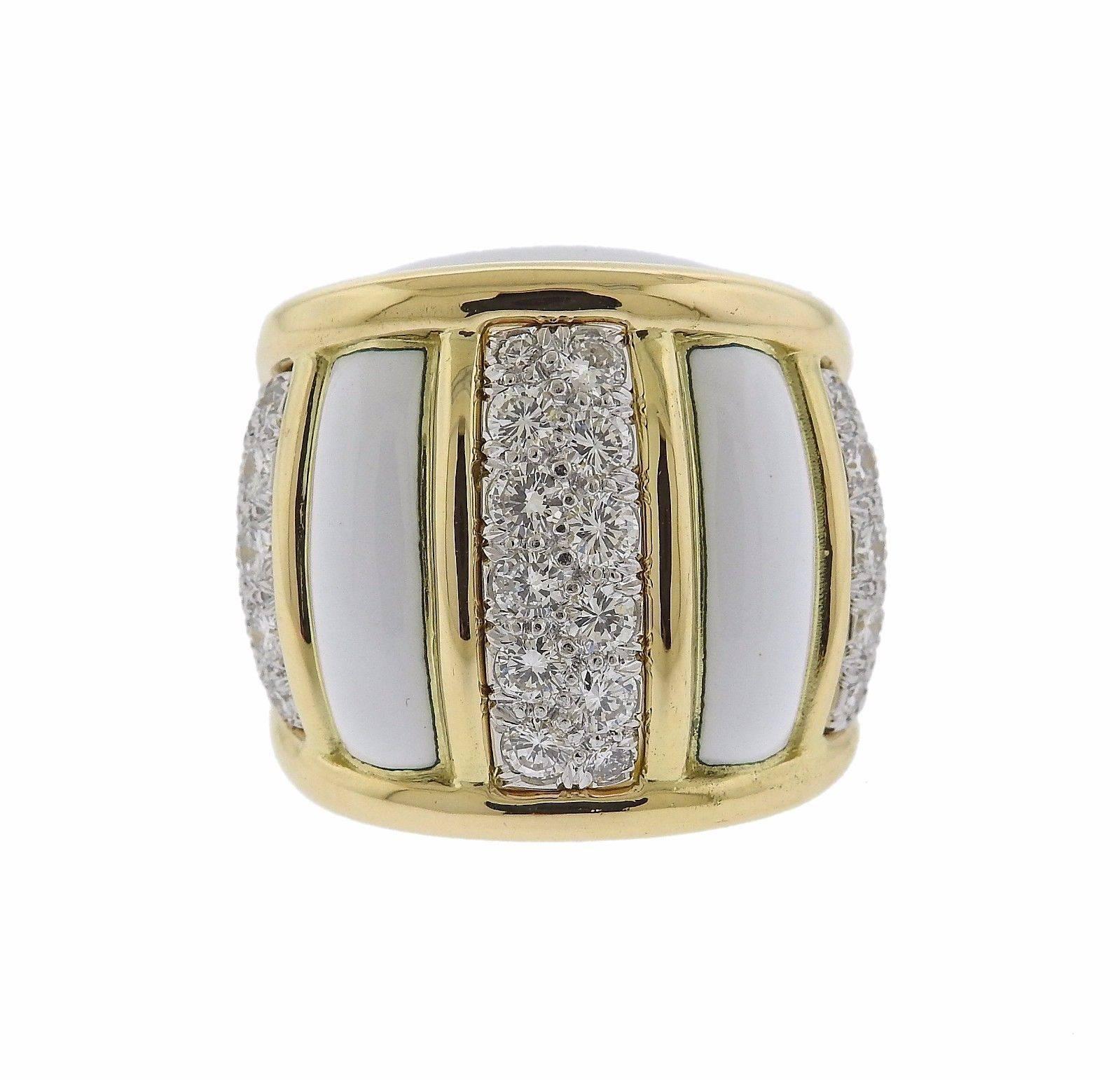 An 18k yellow gold and platinum ring adorned with white enamel and set with 2.40ctw of G/VS diamonds.  The ring is a size 6 and the top measures 23mm x 25mm.  The weight of the ring is 29.2 grams. Marked: plat, 18k, Webb.