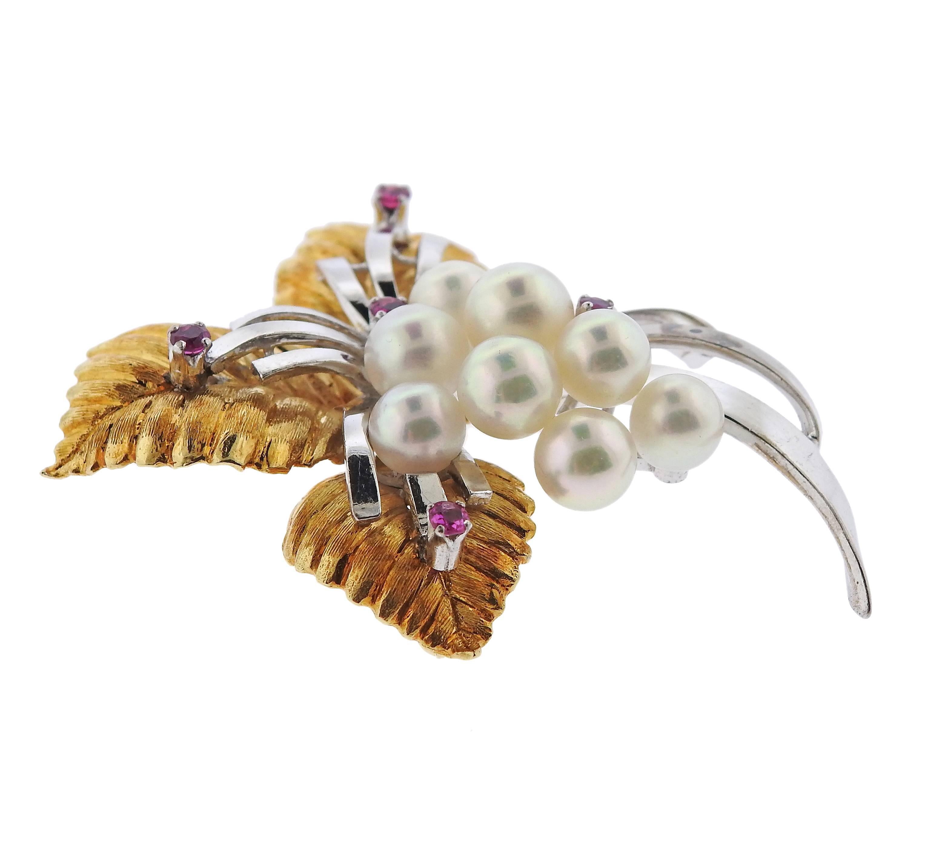 Vintage 18k and 14k gold brooch, designed by Mikimoto, decorated with rubies and 6.5mm to 7.5mm pearls. Brooch is 54mm x 50mm, weight - 25.3 grams. Marked: k18 k14, WG, Mikimoto M hallmark.