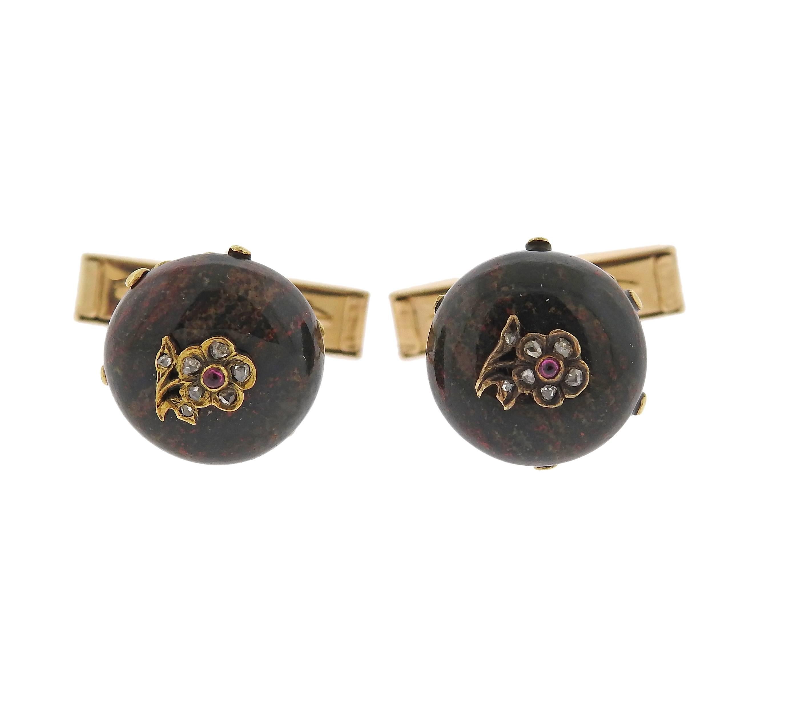 Pair of 18k gold antique cufflinks, featuring bloodstone top, decorated with rose cut diamonds and rubies, set in flower design in the center. Top measures 13.7mm in diameter, weight - 9.4 grams. Top tested 18k, hardware marked 14k . 