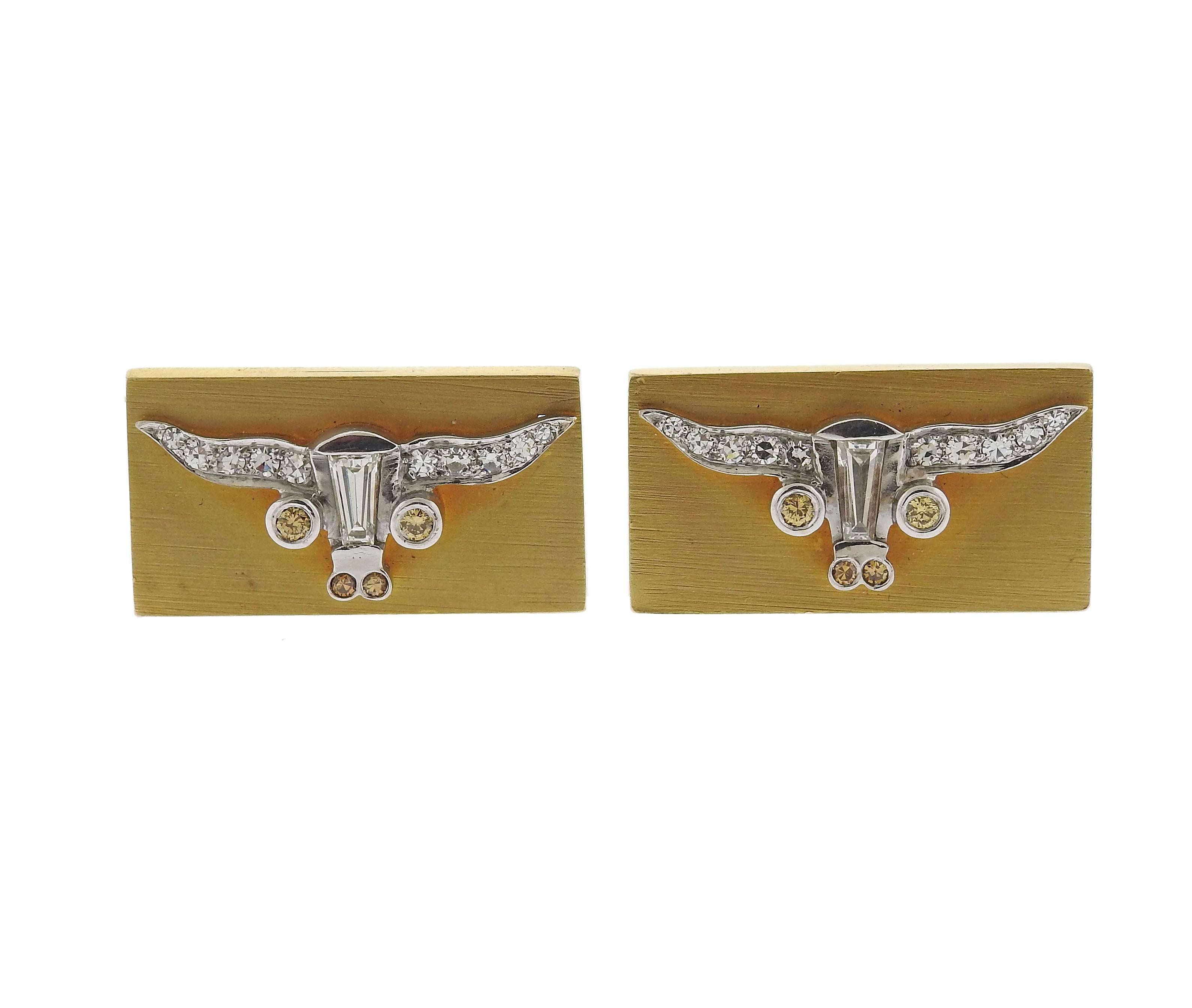 Pair of 14k gold rectangular cufflinks, featuring longhorn bull, decorated with approximately 0.50ctw in white and yellow diamonds. Top measures 26mm x 14.5mm, weight - 20. 3 grams 