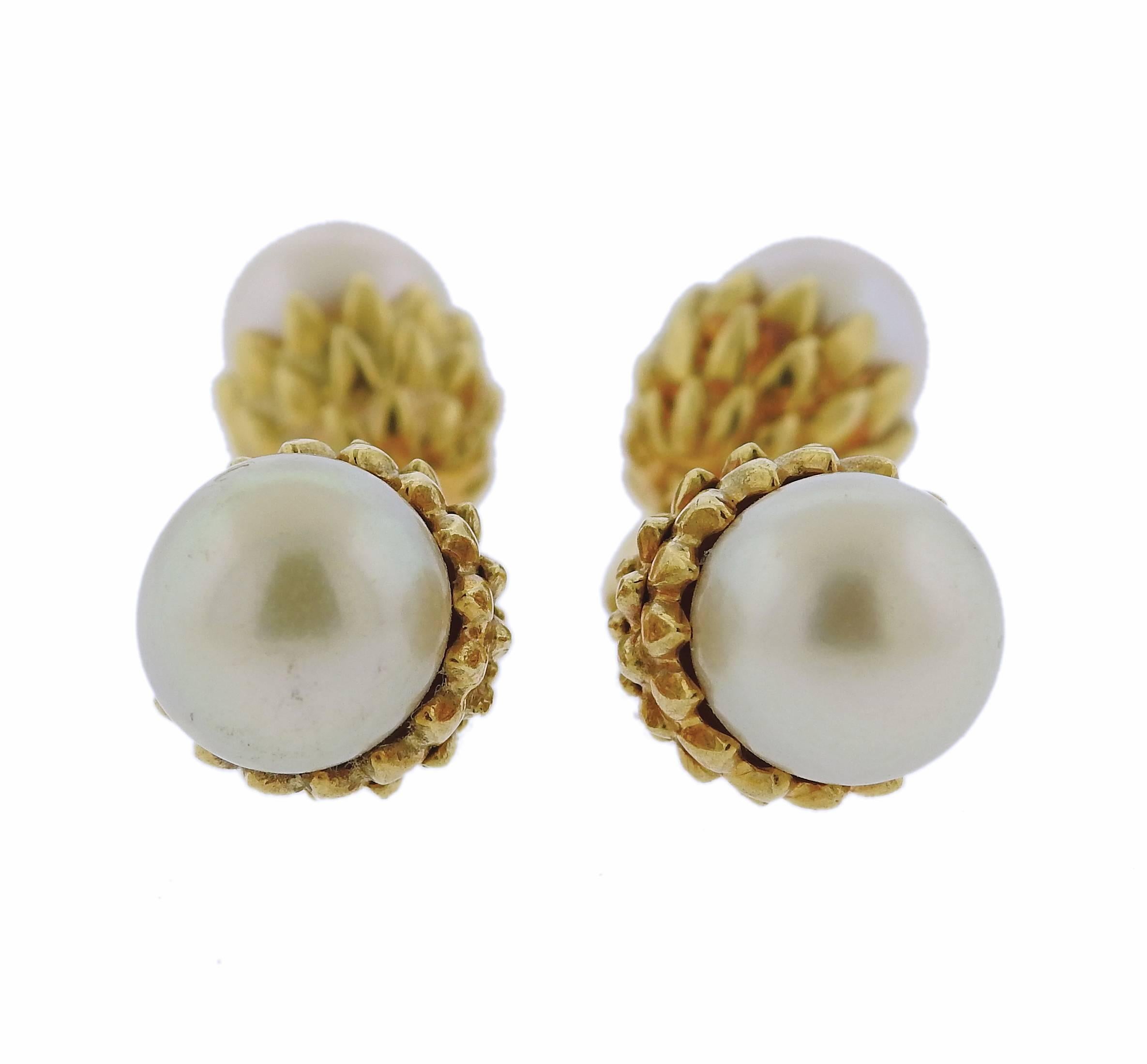 Pair of 18k yellow gold cufflinks, set with 8.2mm and 9.6mm pearls. Top measures 11mm in diameter, back - 9.3mm in diameter, weight - 18.2 grams. Marked: 18k.
