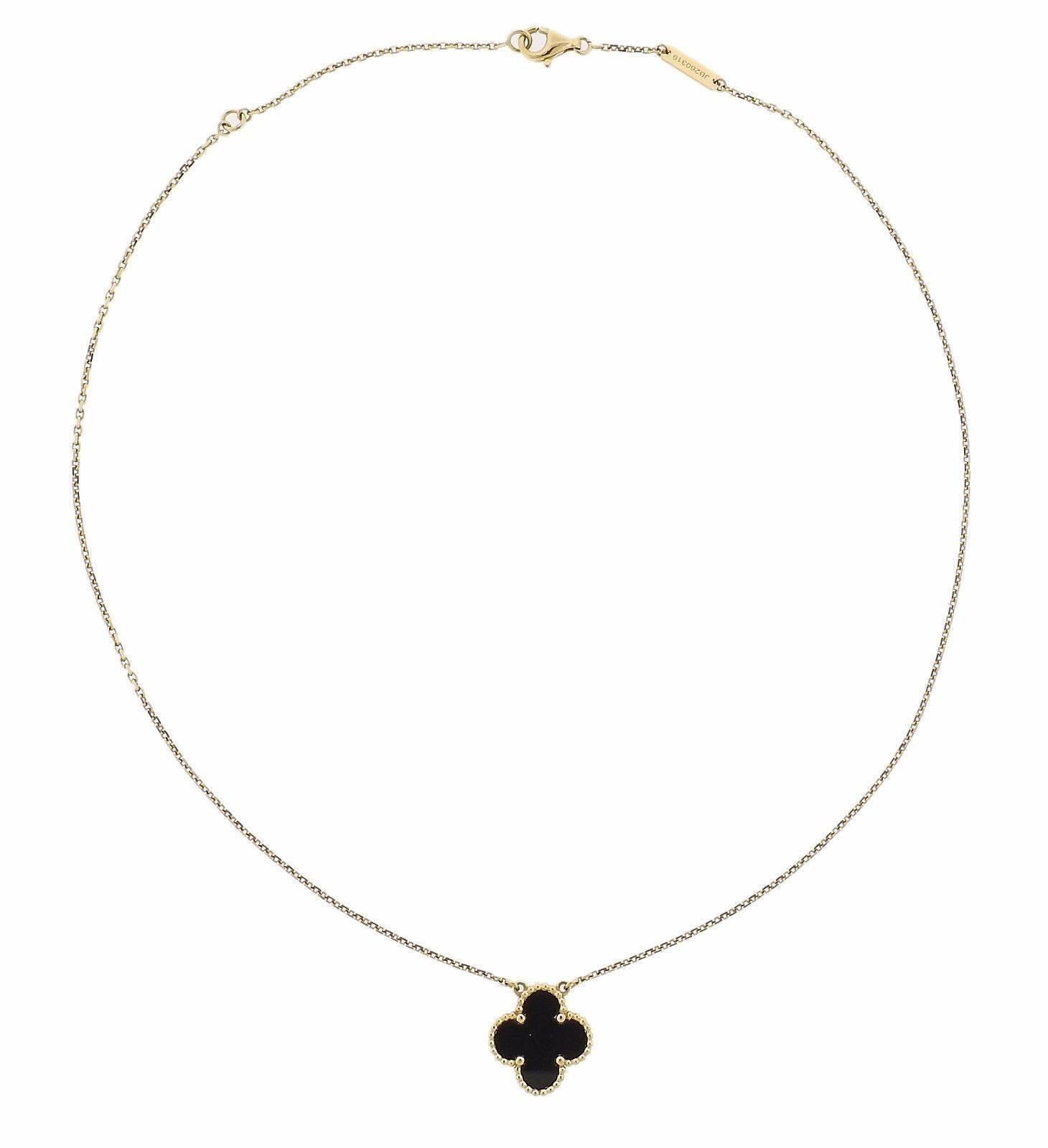 An 18k yellow gold necklace set with an onyx pendant.  The necklace is 15 1/2
