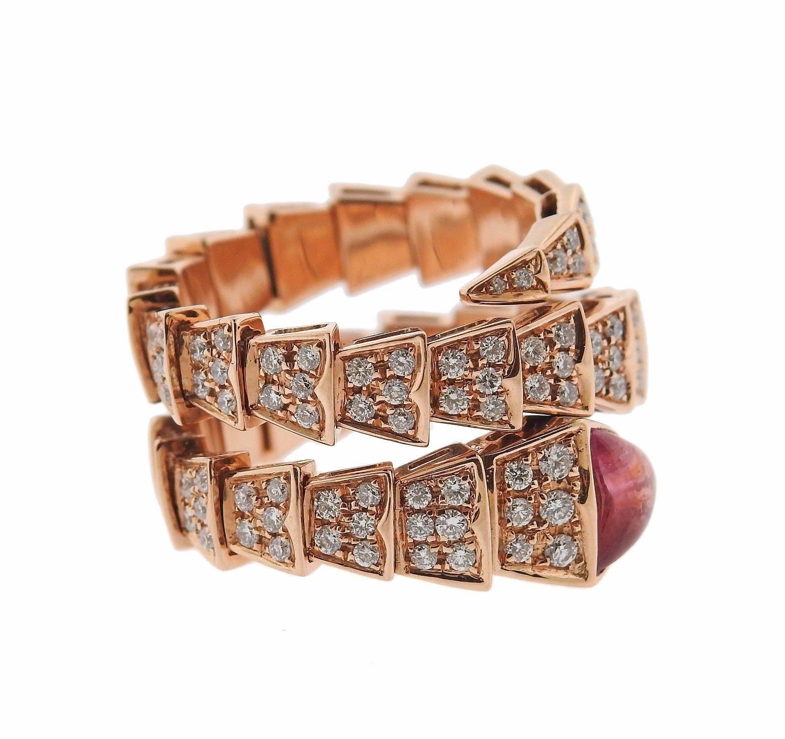 An 18k rose gold ring set with a tourmaline and approximately 2.50ctw of G/VS diamonds.  The ring is a size 7 (slightly flexible due to ring design) and is approx. 16mm wide.  The weight of the piece is 14.5 grams. Marked: Bvlgari, 750, made in