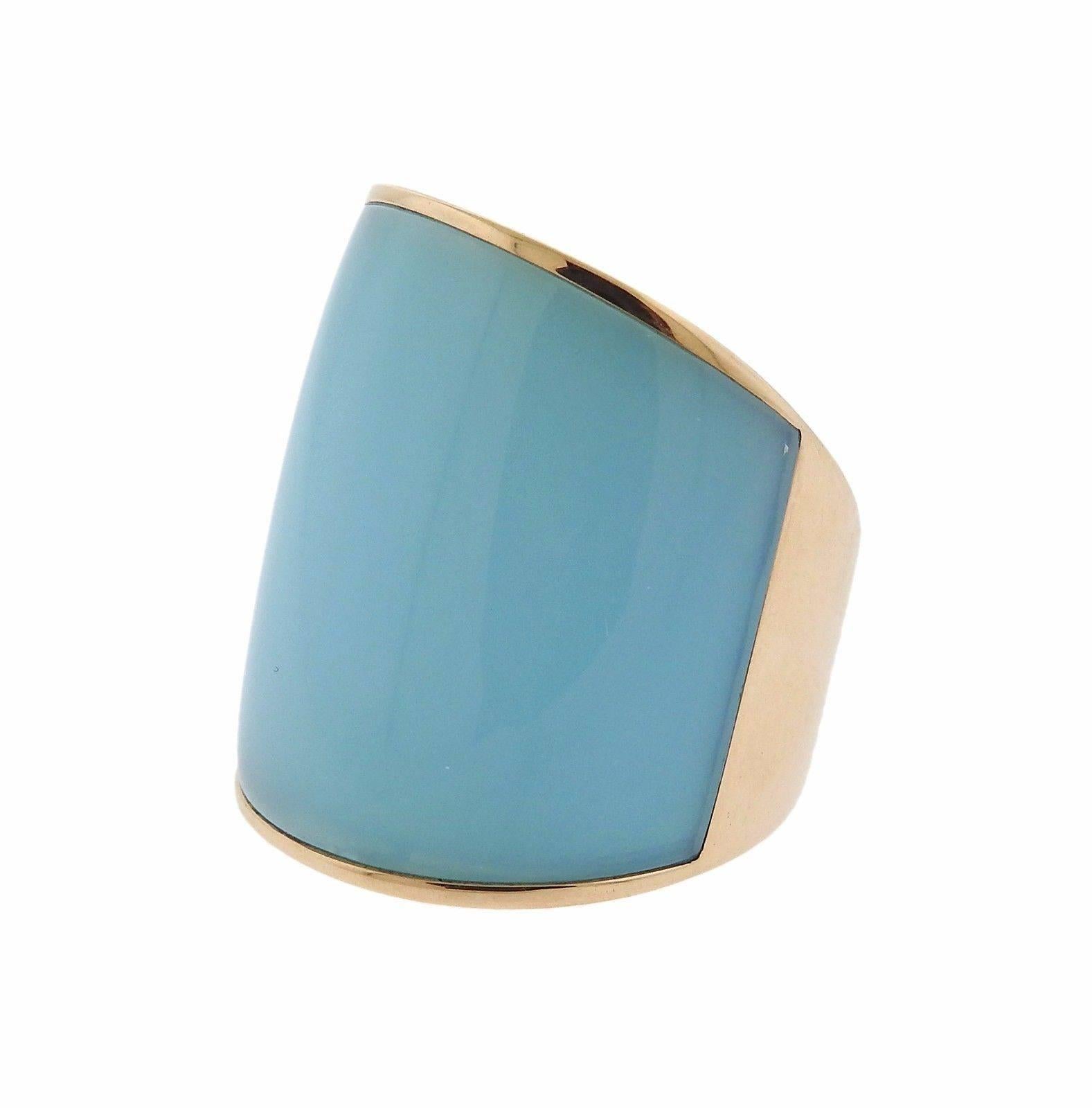 An 18k rose gold ring set with turquoise and chalcedony.  The ring is a size 7 1/2 and measures 28mm in width.  The weight of the piece is 29.8 grams.  Marked: 26B, Vhernier, 750.