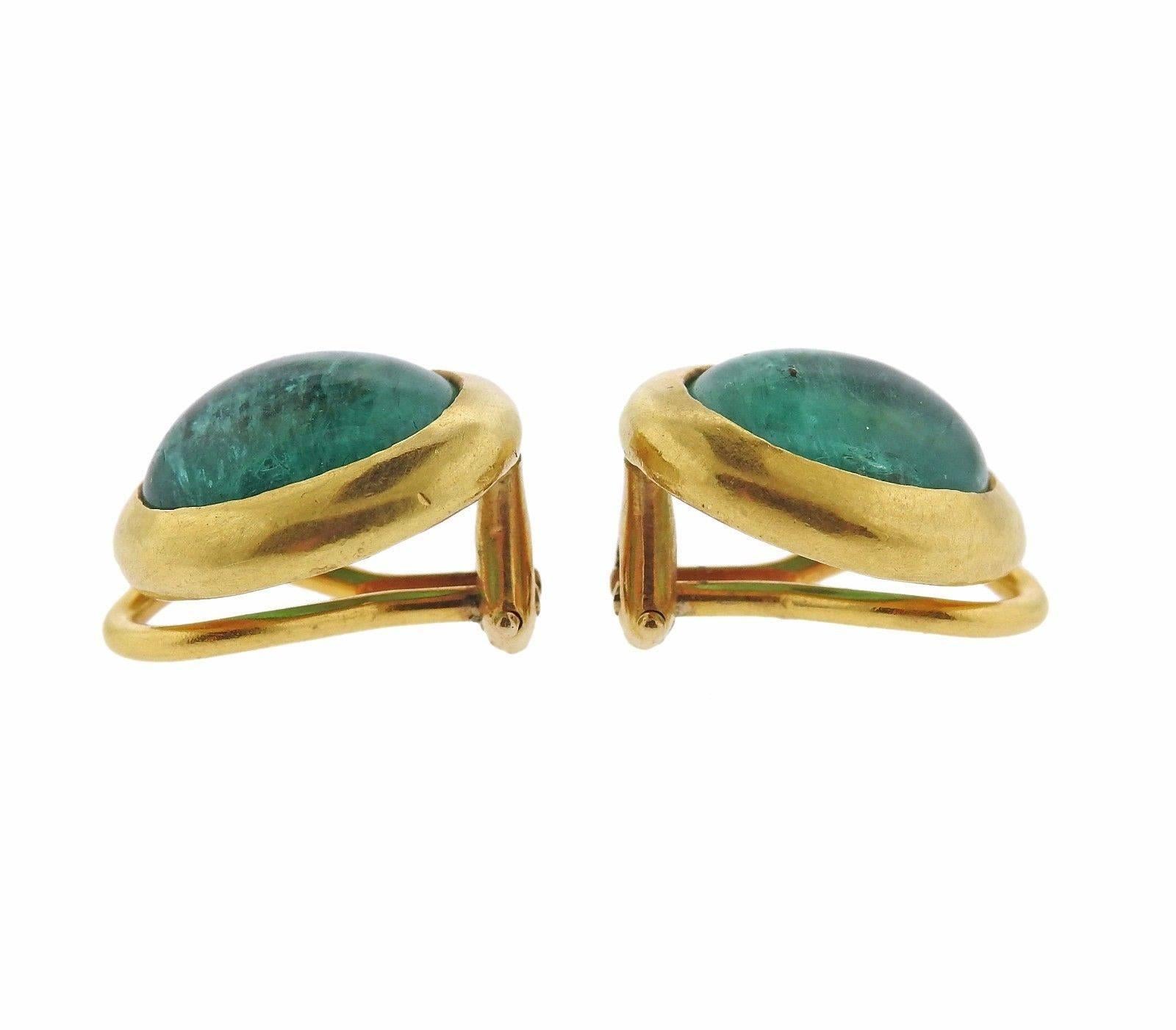 A pair of 22k yellow gold earrings set with emerald cabochons.  The earrings measure 14.4mm x 12.5mm and weigh 8.8 grams.  Marked: XXII, Au, Maker's mark.