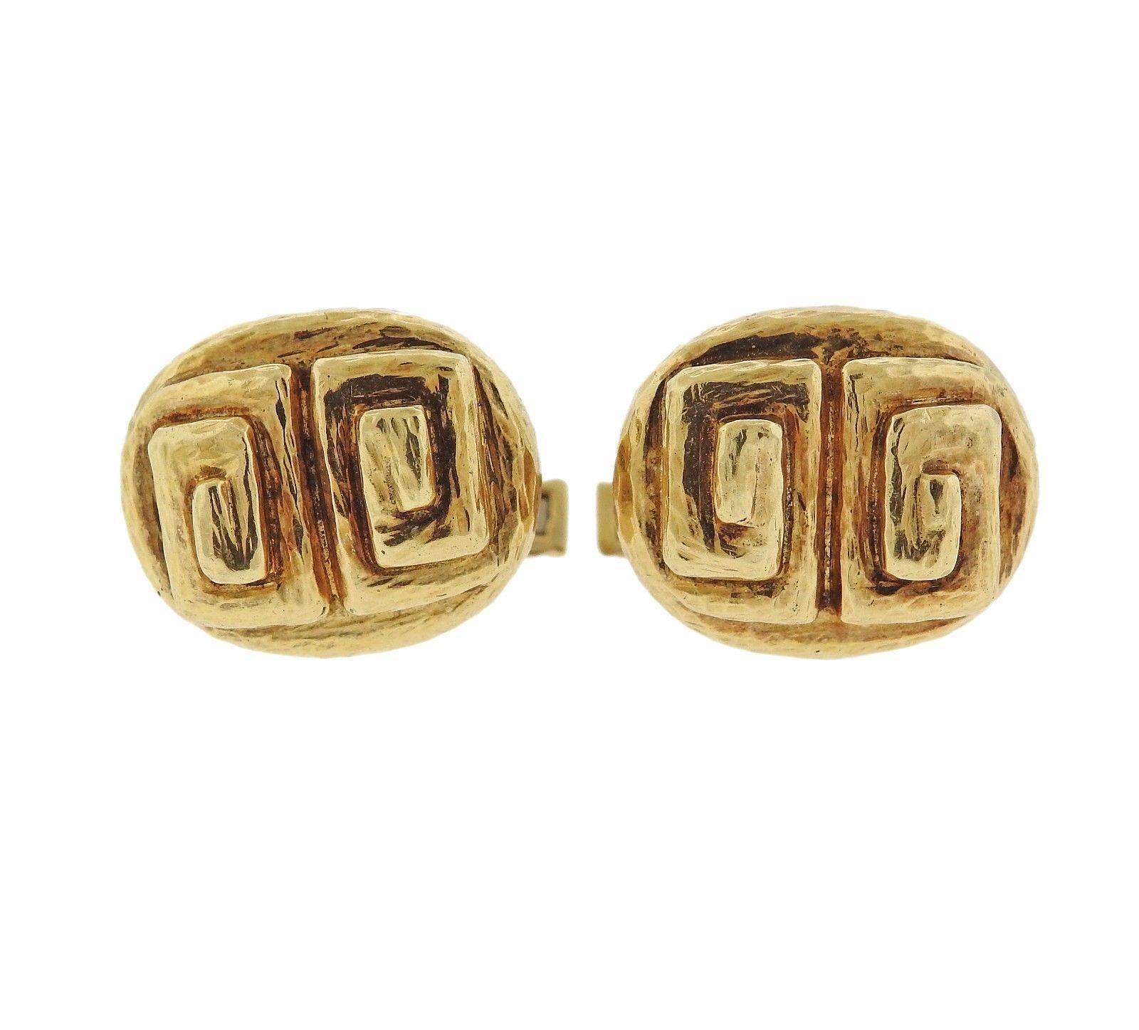 A pair of 18k yellow gold cufflinks by David Webb. The cufflinks measure 18mm x 15mm and weigh 17 grams.  Marked: 18k, Webb.