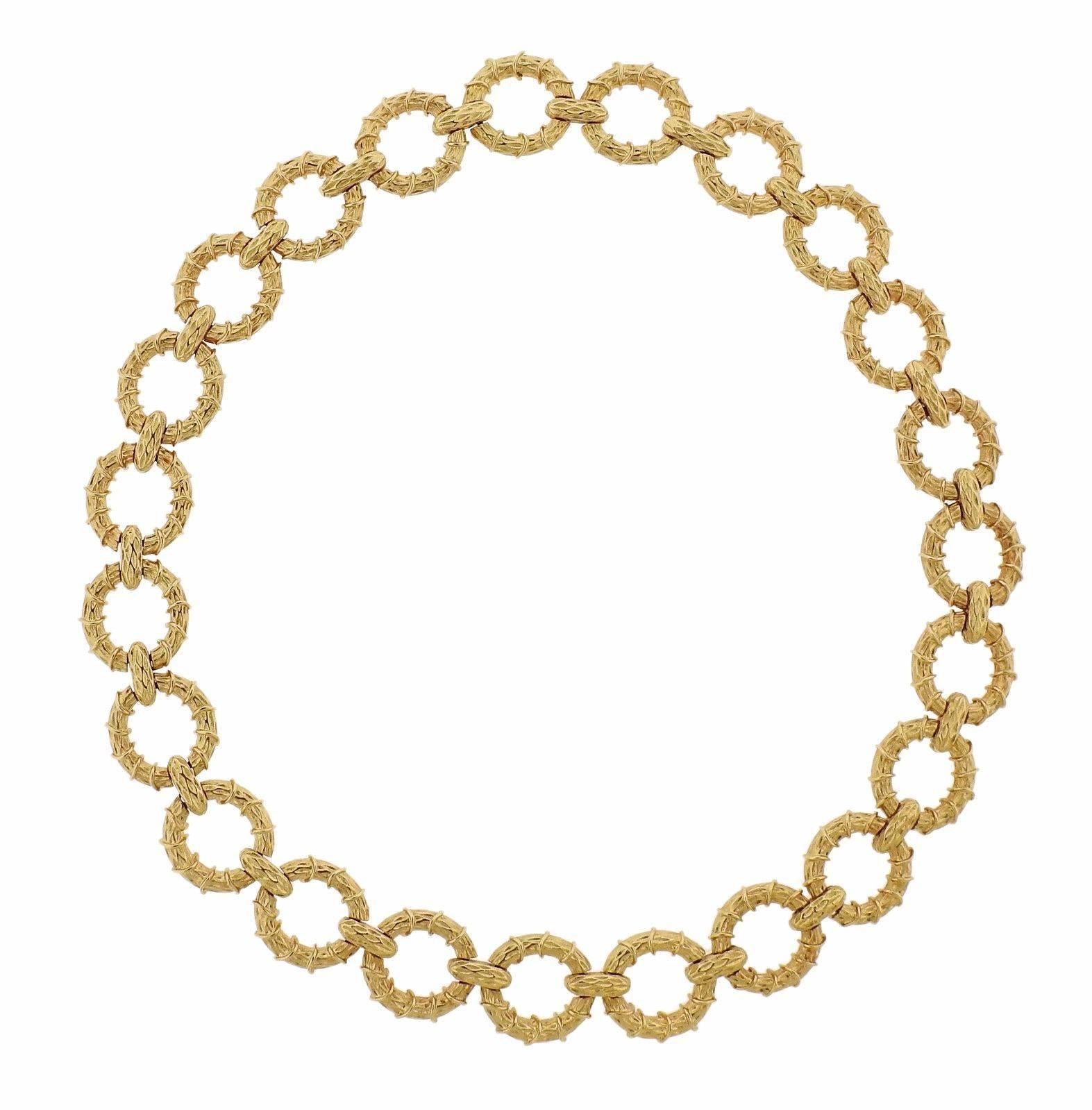 An 18k yellow gold bracelet and necklace suite.  The necklace is 21" long (with two sets of extra removable links - 3"each, on each side). Bracelet is 7 /4" long. Each piece is 20mm wide.  The weight of the set is 192 grams.
