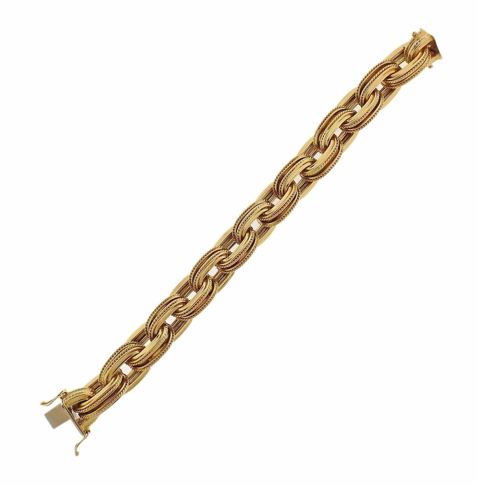 An 18k yellow gold bracelet.  The bracelet is 8" long and 15mm wide.  The piece will fit an approximately 6 3/4" wrist.  The weight of the piece is 68.3 grams.  Marked: 18k Italy OTC.