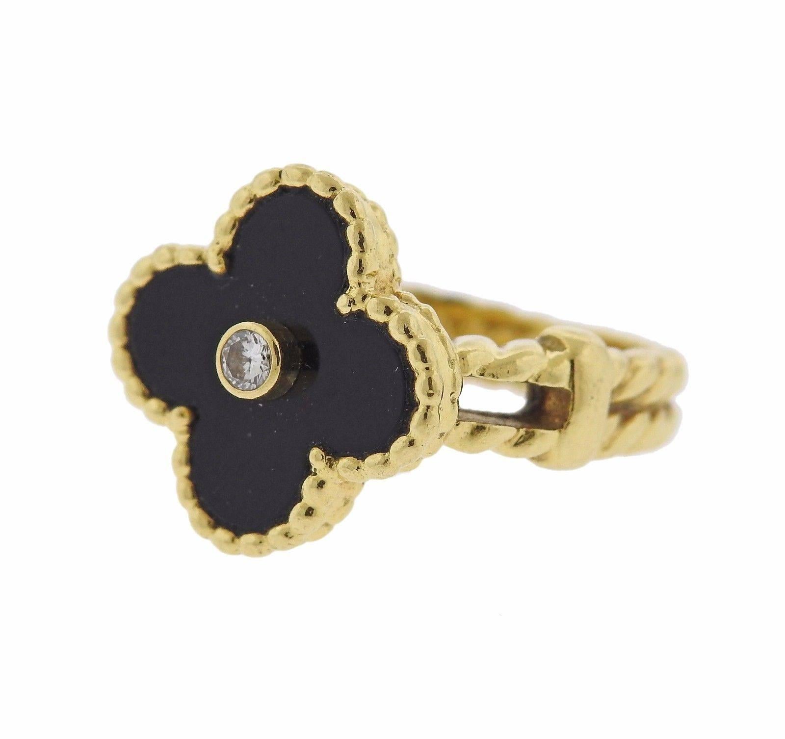 An 18k yellow gold ring set with onyx and a VVS/F-G diamond weighing approximately 0.05ctw.  The ring is a size 4. The ring top measures 15mm x 15mm.  The weight of the piece is 7.3 grams.  Marked: VCA 750, AL0500N****.