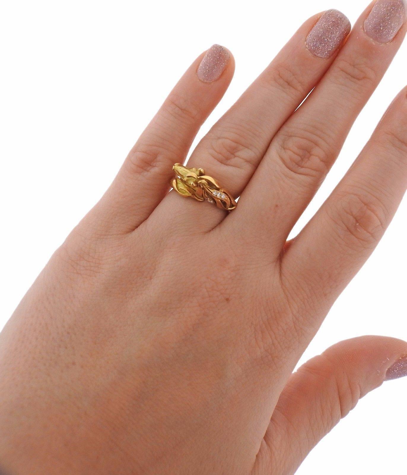 An 18k yellow gold ring set with approximately 0.07ctw of H/VS diamonds.  The ring is a size 6 1/4, horse head is 10mm x 21mm.  The weight of the piece is 7.1 grams. Marked: J. P. Bellin, Gold assay marks.