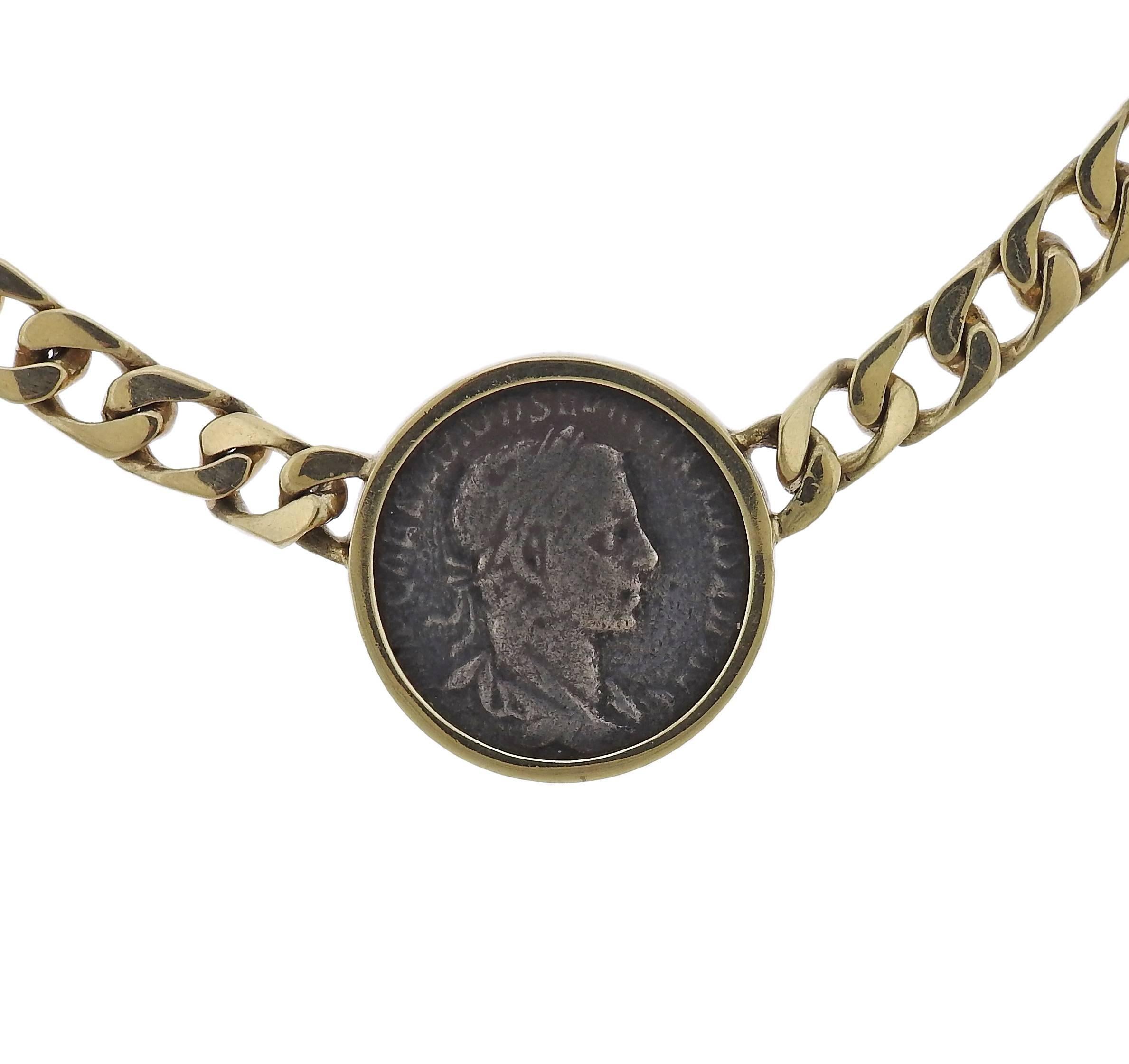 An 18k yellow gold chain necklace, set with ancient coin in the center. Necklace is 14 1/2" long, pendant - 29mm in diameter. Weight of the piece - 80.3 grams 