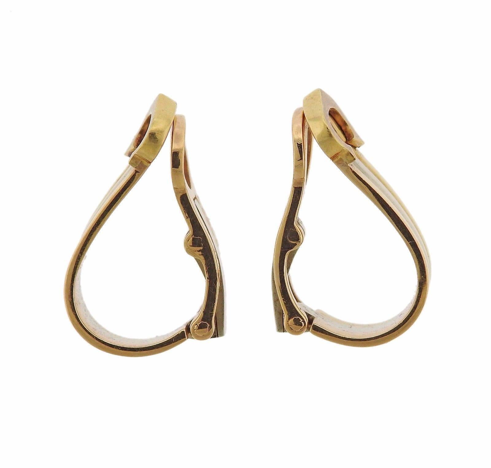 A pair of 18k yellow, white and rose gold earrings by Cartier.  The earrings measure 16mm x 7mm and weigh 5.4 grams.  Marked: Cartier, 750, 760920.