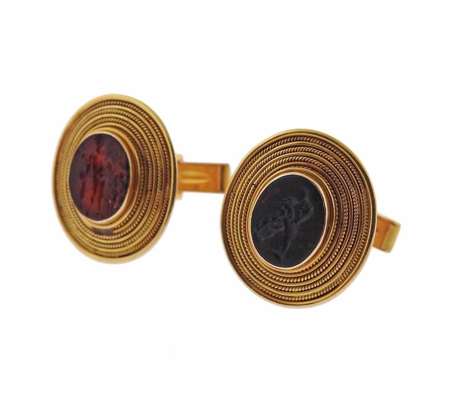 A pair of 14k yellow gold cufflinks set with hardstone intaglio.  The cufflinks measure 23mm x 21mm and weigh 17 grams.