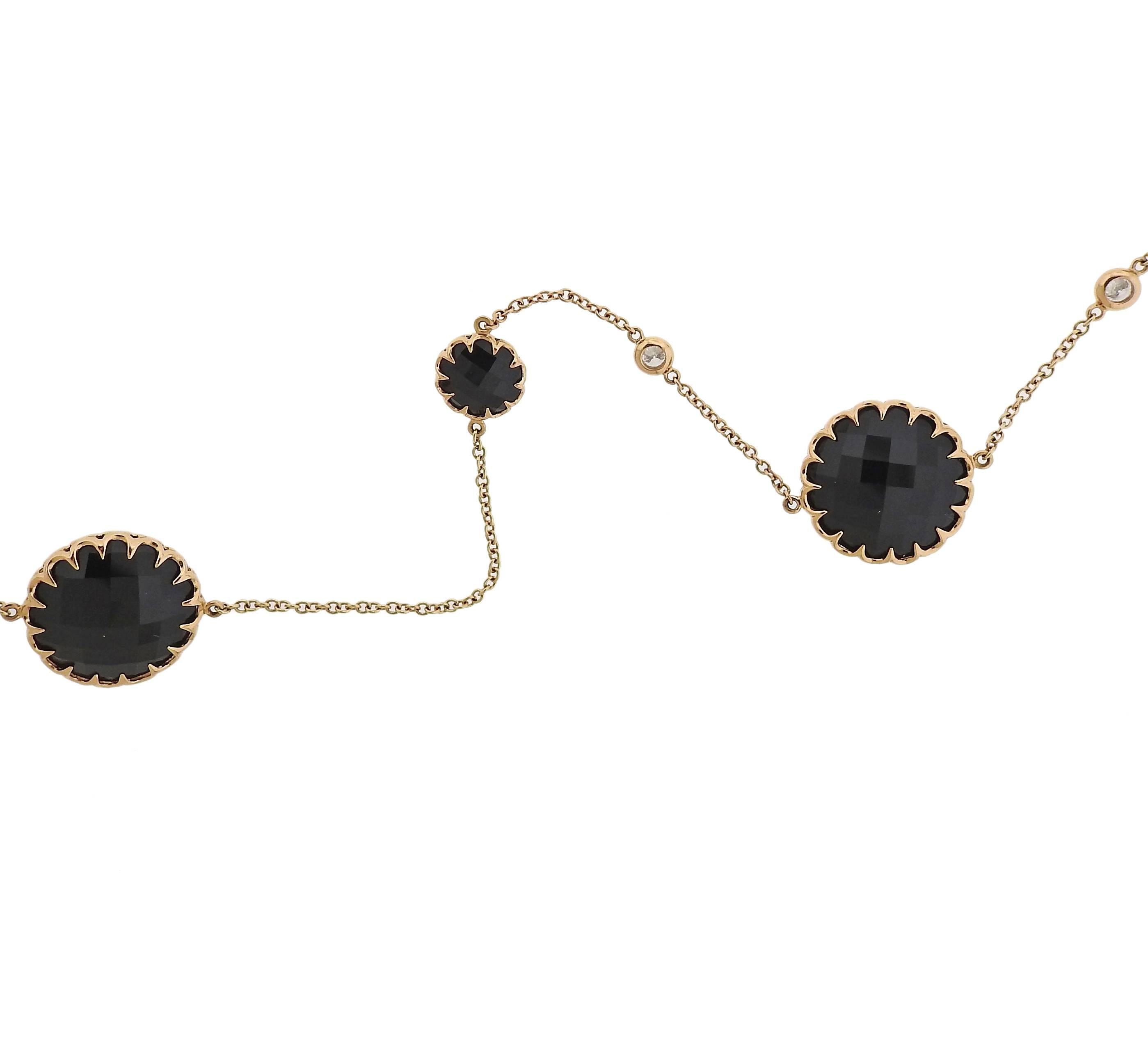 An 18k rose gold long necklace, crafted by Ivanka Trump, decorated with 9mm and 16.3mm faceted onyx station, and approx. 0.52ctw in G/VS diamonds. Necklace is 40" long. Marked: Ivanka Trump, 750, N8861. Weight - 30.9 grams 
Retail $4680