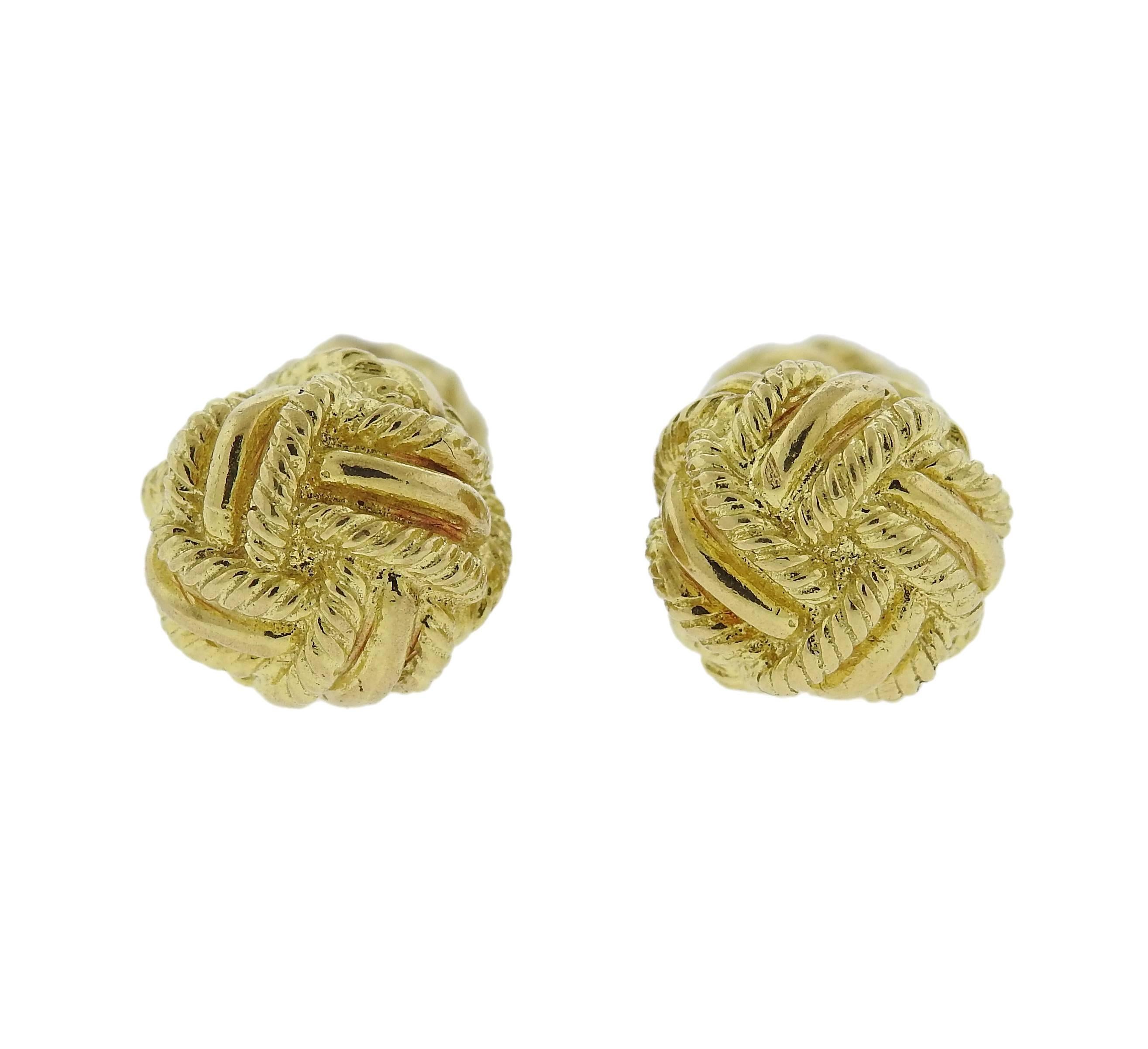 Pair of classic woven knot cufflinks, crafted by Tiffany & Co in 18k yellow gold. Cufflink top - 11.5mm in diameter, back - 9mm. Marked: Tiffany & Co, 18k. Weight - 30.3 grams 
