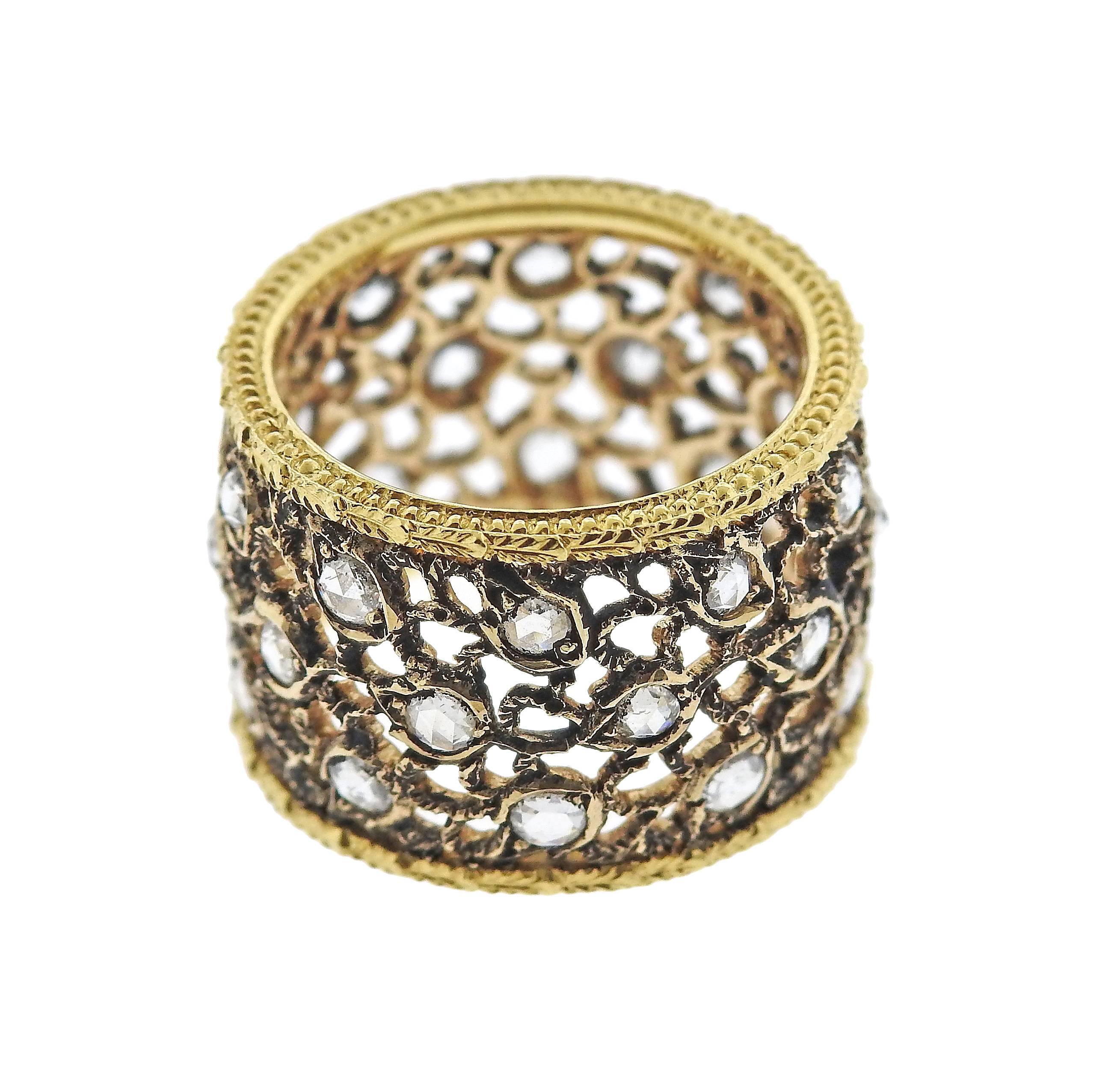 18k yellow gold and burnished white gold openwork wide band ring, crafted by Buccellati, decorated with rose cut diamonds. Ring size 5 , ring is 13.3mm wide, weighs 7.1 grams. Marked: 750, 18k, Italy, Buccellati R5244. 