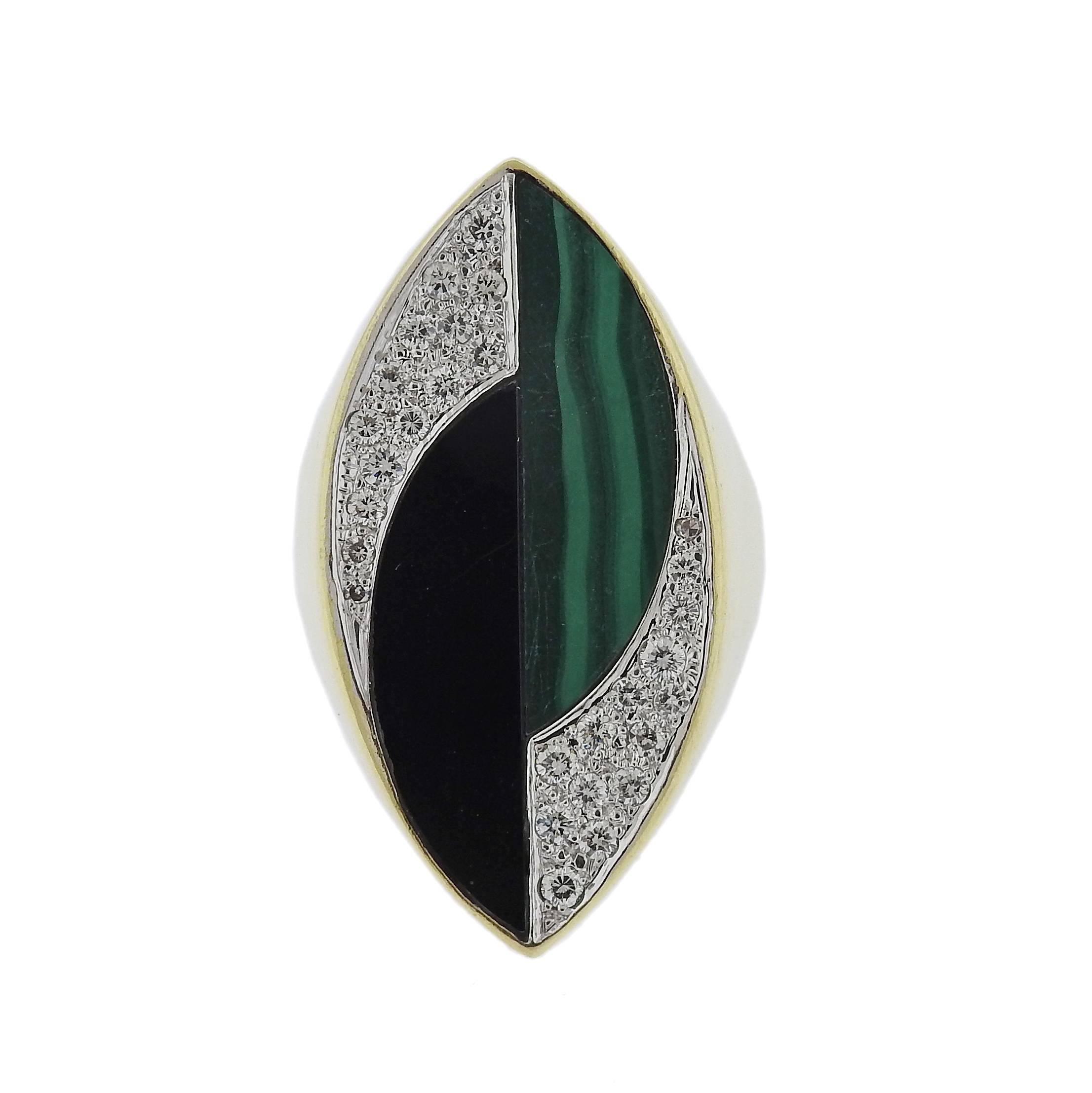 18k gold ring, crafted by La Triomphe, decorated with approximately 0.55ctw in diamonds, onyx and malachite. Ring size - 7, ring top is 35mm x 17mm, weight - 17.4 grams. Marked: 18kt, La Triomphe. 