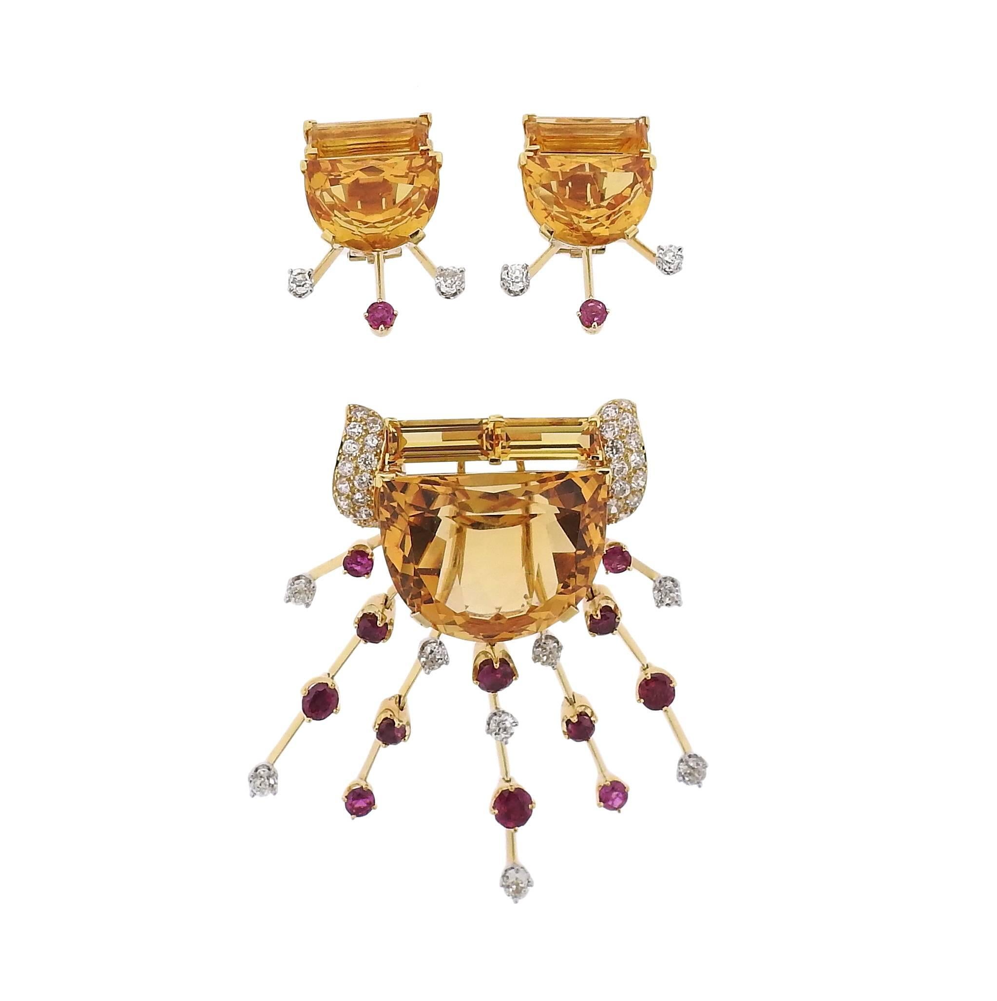 A suite of 18k gold retro earrings and brooch featuring ruby, citrine and approximately 3.00ctw of H/ VS-SI diamonds. Brooch (converts into a pendant) measures 63mm x 58mm, Earrings measure 28mm x 23mm. Weight is 67.1 grams,
