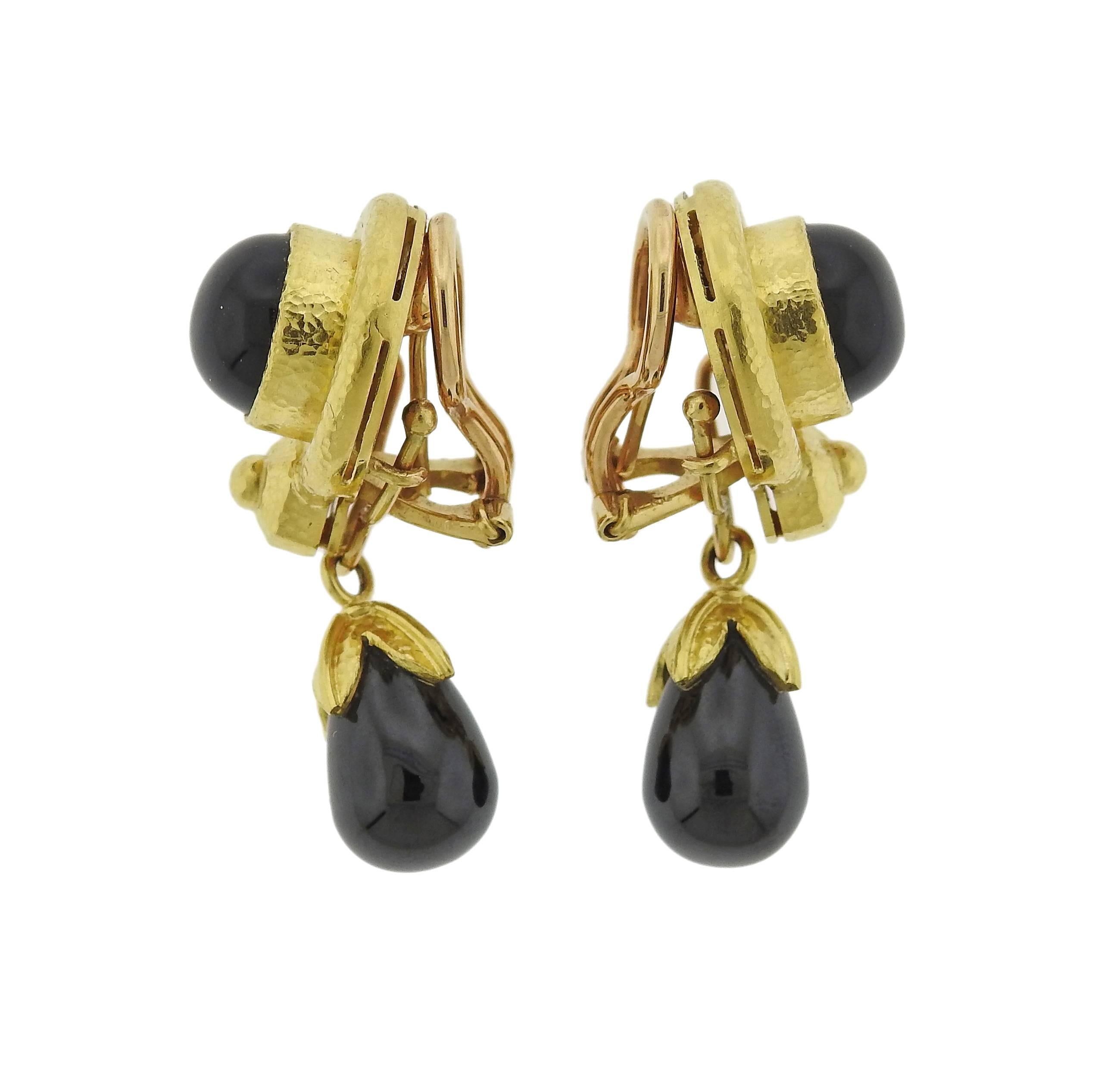 Pair of drop earrings, crafted by Elizabeth Locke, set in signature 19k yellow gold, featuring black onyx. Earrings are 36mm x 17mm at widest point. Weight - 23.2 grams. Marked: Locke hallmark, 19k. 