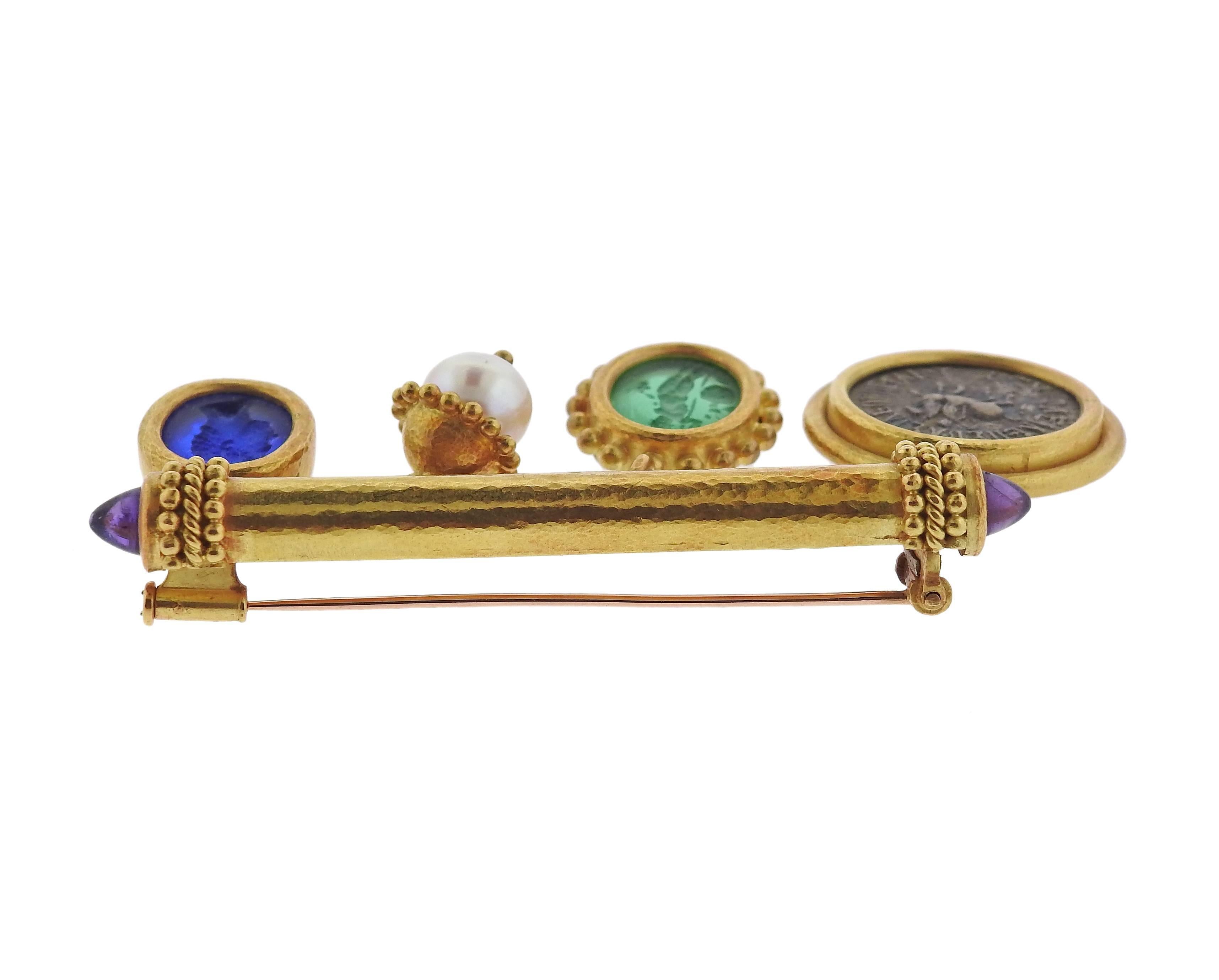 An 18k yellow gold brooch, crafted by Elizabeth Locke, set with charms, decorated with Venetian glass intaglio, ancient coin, pearl and two amethyst cabochons. Brooch is 65mm x 43mm long, weighs 38.7 grams. Marked: E mark, 18k. 