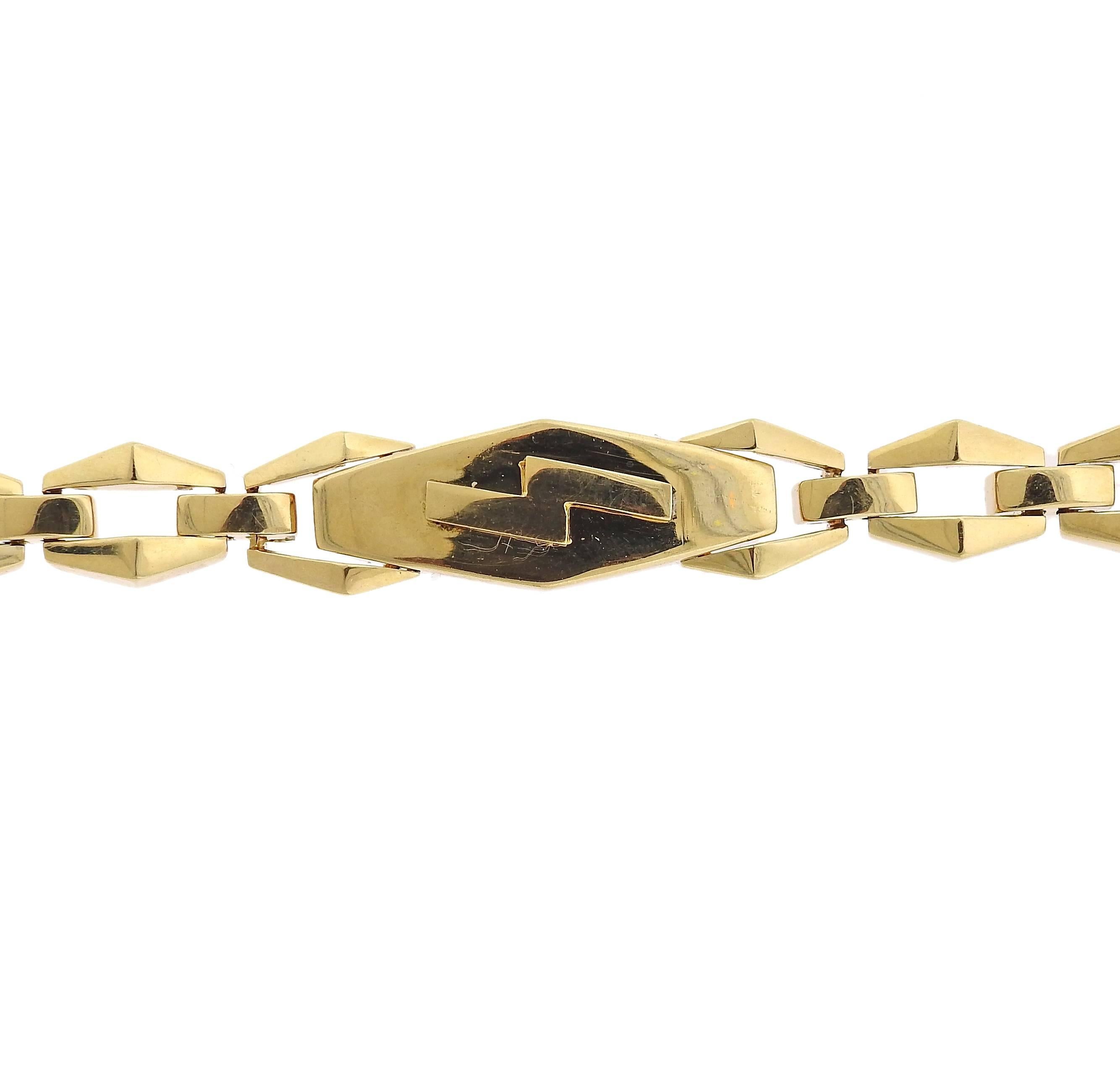 An 18k gold link bracelet crafted by David Webb. Bracelet measures 6 1/2