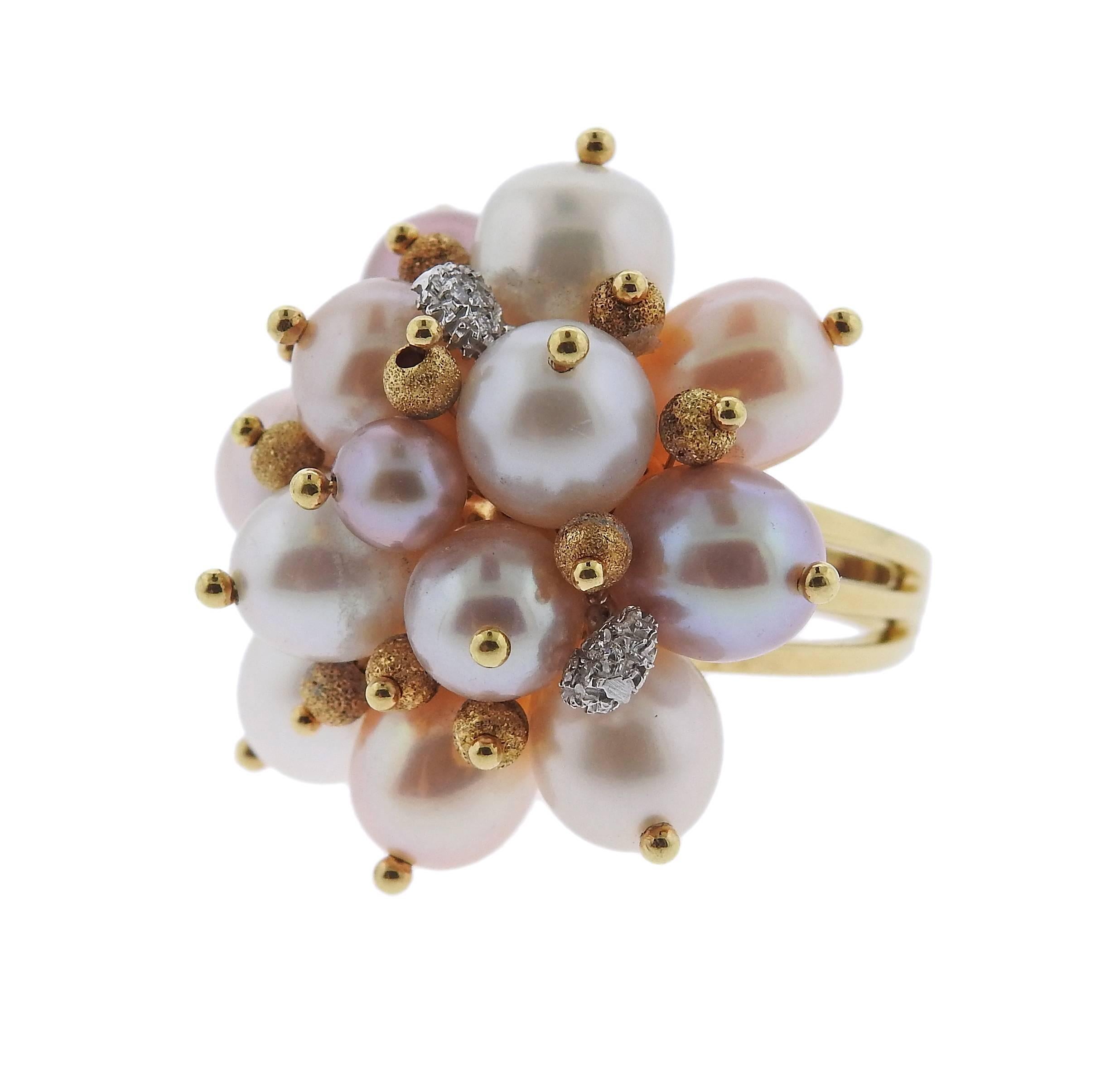 An 18k gold cocktail ring, crafted by Zoccai, set with  5.6mm to 8.4mm pearls and approx. 0.08ctw in diamonds. Ring is a size 6 3/4, ring top is 31mm x 32mm. Marked: Zoccai, 750, 314VI. Weight of the piece - 22.9 grams. 