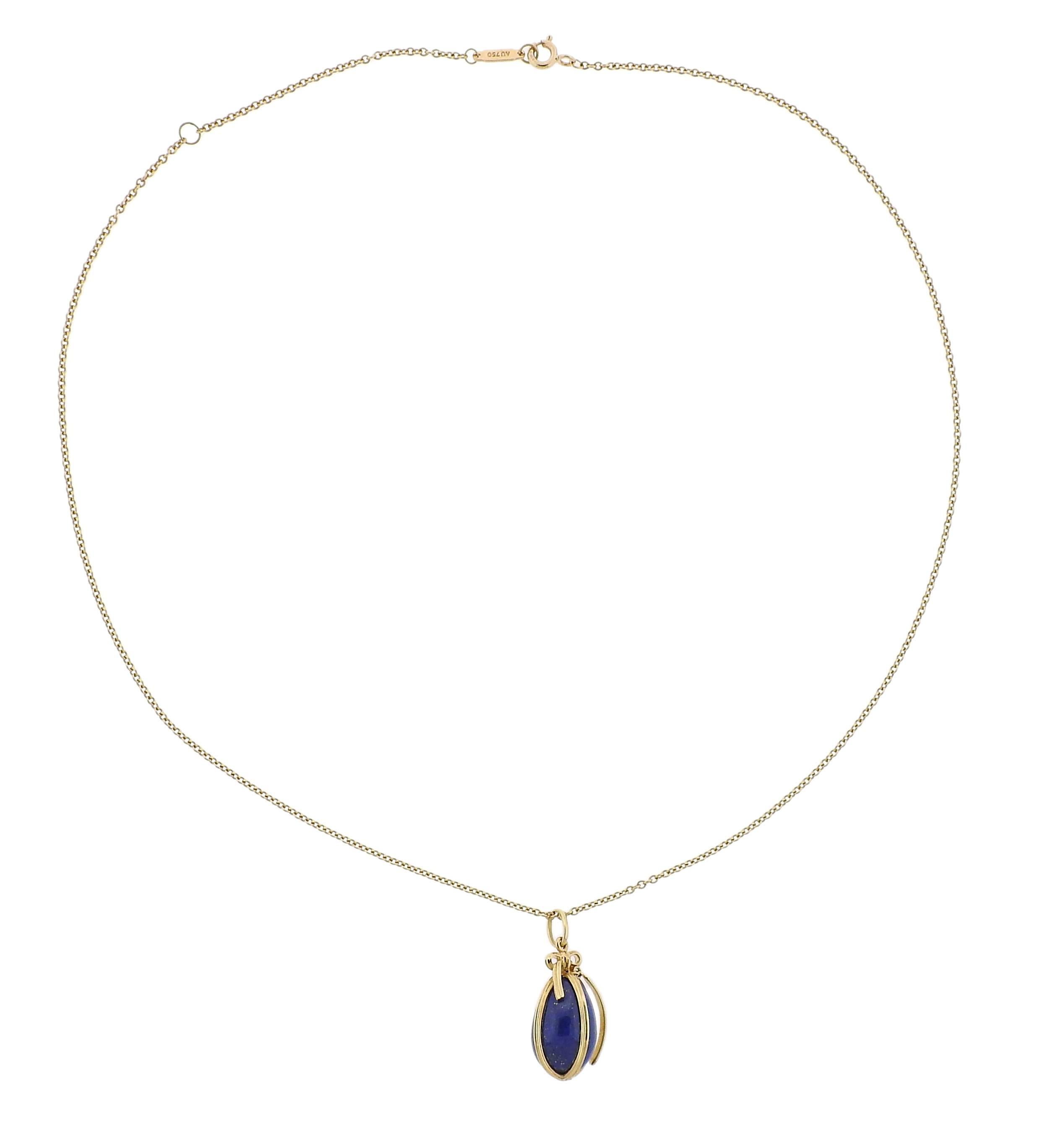 An 18k yellow gold pendant necklace, crafted by Jean Schlumberger for Tiffany & Co, featuring lapis lazuli egg charm.  Necklace is 18 inches long, Pendant measures 26mm x 12.5mm. Marked: Tiffany & Co, , Schlumberger Studios, T & Co,