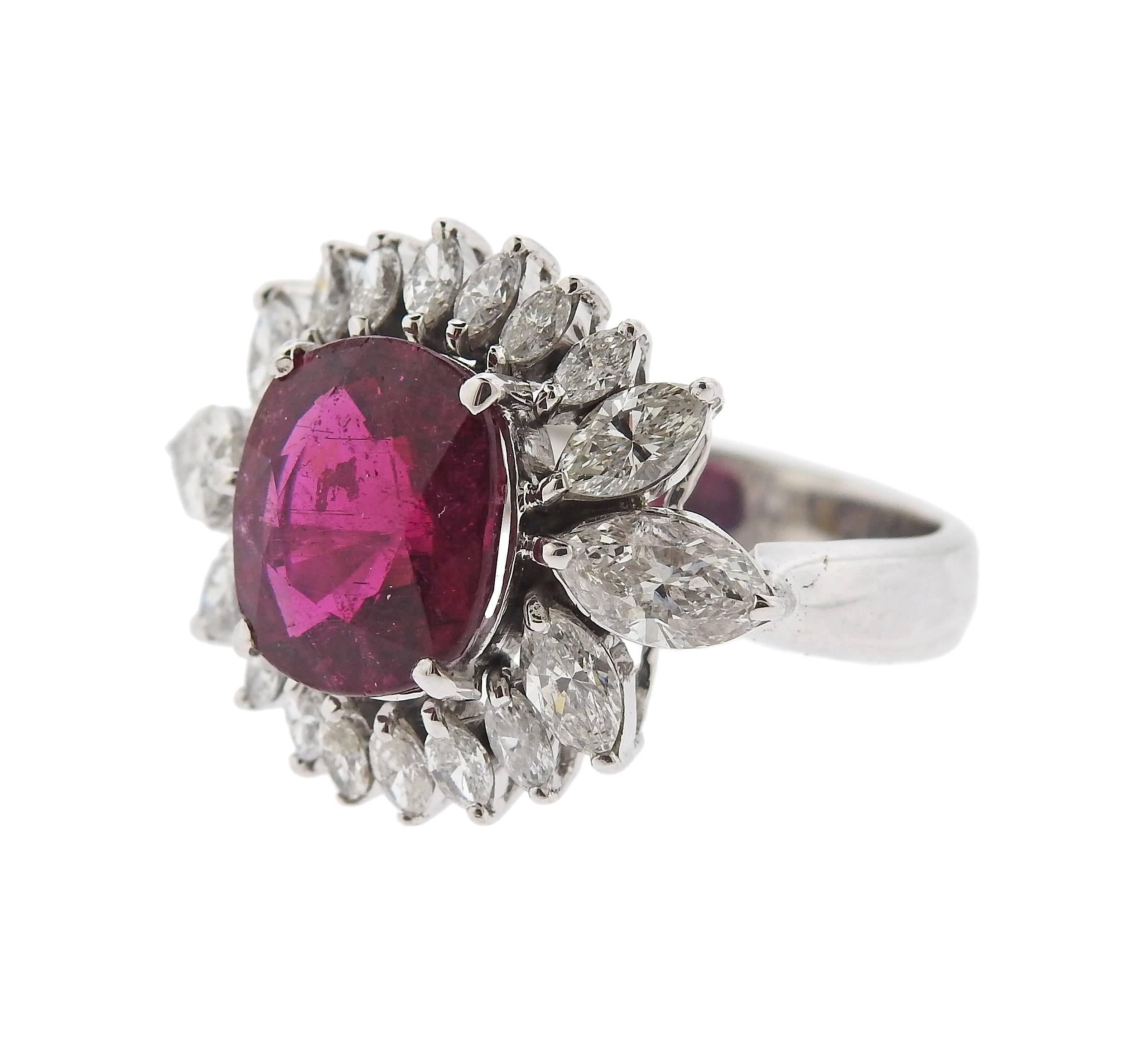 An 18k white gold cocktail ring, decorated with 4.17ct pink tourmaline centerpiece, surrounded with 2.00ctw in diamonds. Ring is a size -7 14, ring top is 18mm x 24mm.  Marked: k18wg, 4.17,2.00. Weight of the piece - 7.4 grams.