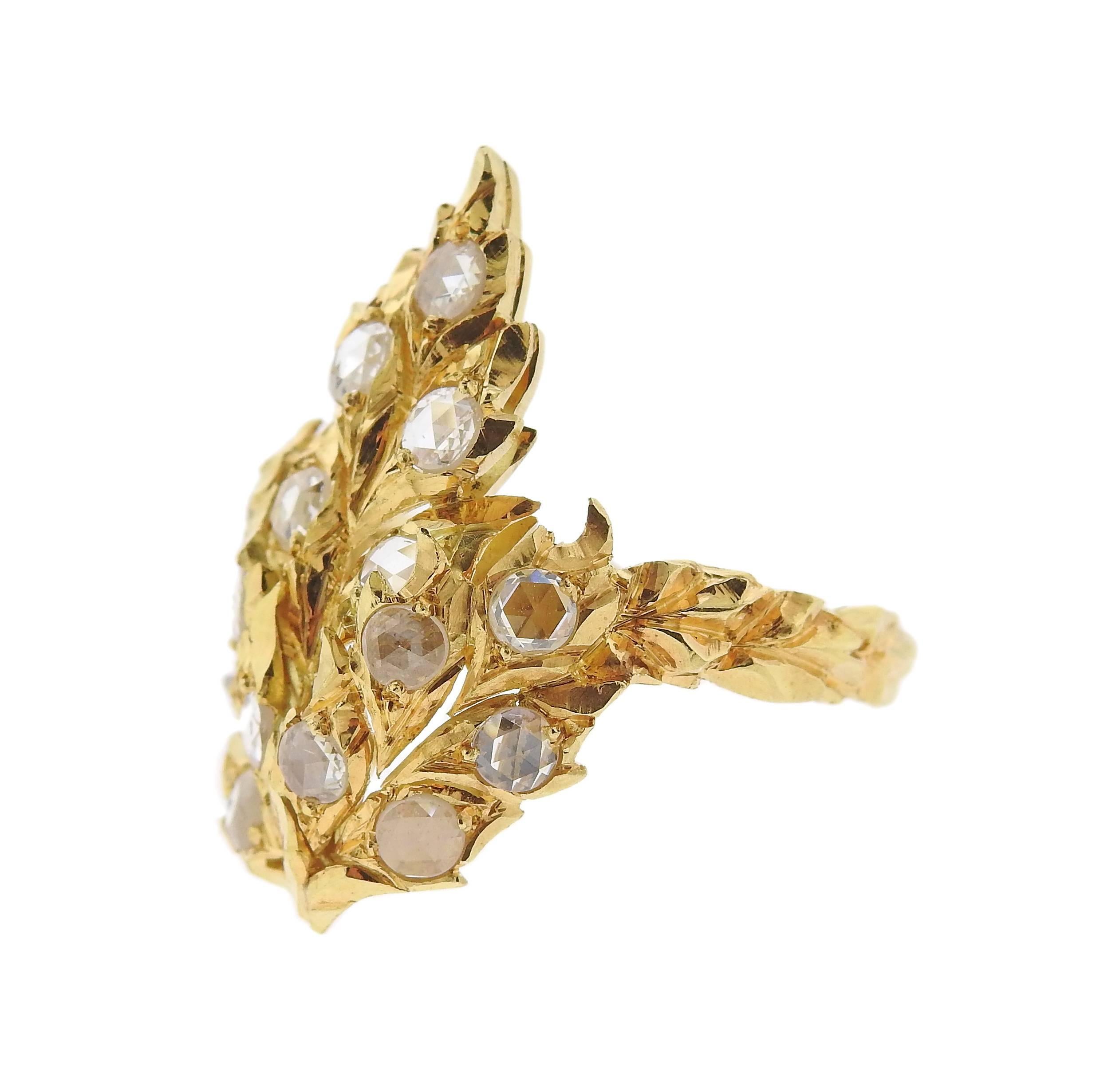 An 18k yellow gold ring, crafted by Buccellati, featuring leaf motif, decorated with rose cut diamonds. Ring size - 7, ring top is 26mm x 18mm. Marked: V1922, Buccellati, Italy, 18k, 750. Weight - 7 grams.
Comes with pouch. Retail $29500.

