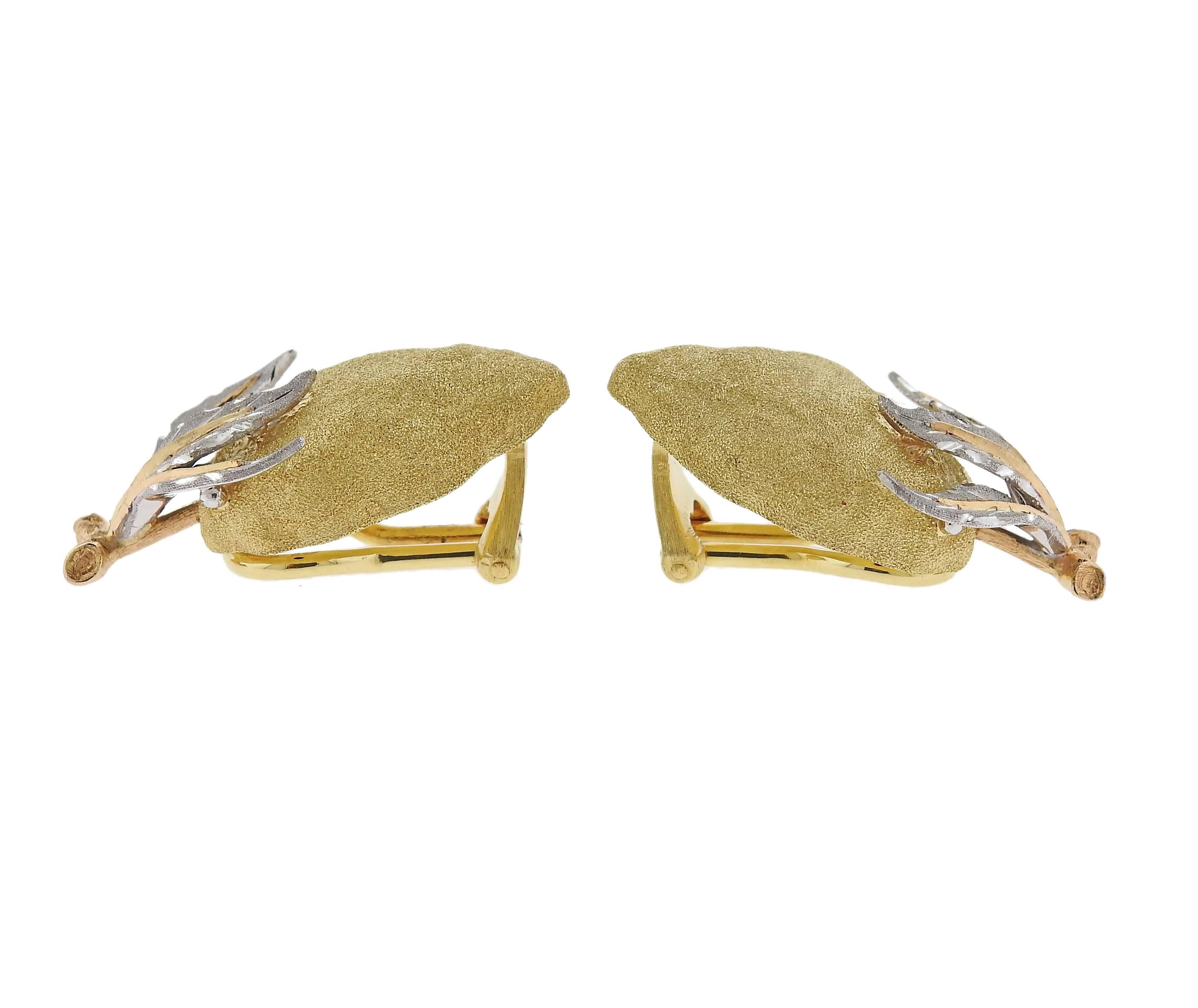 A pair of 18k rose, white and yellow gold earrings, crafted by Buccellati, featuring lemons. Earrings are 29mm x 15mm. Marked: Buccellati, 750, G4033, Italy. Weight - 16 grams.
Come with pouch. Retail $11100. 