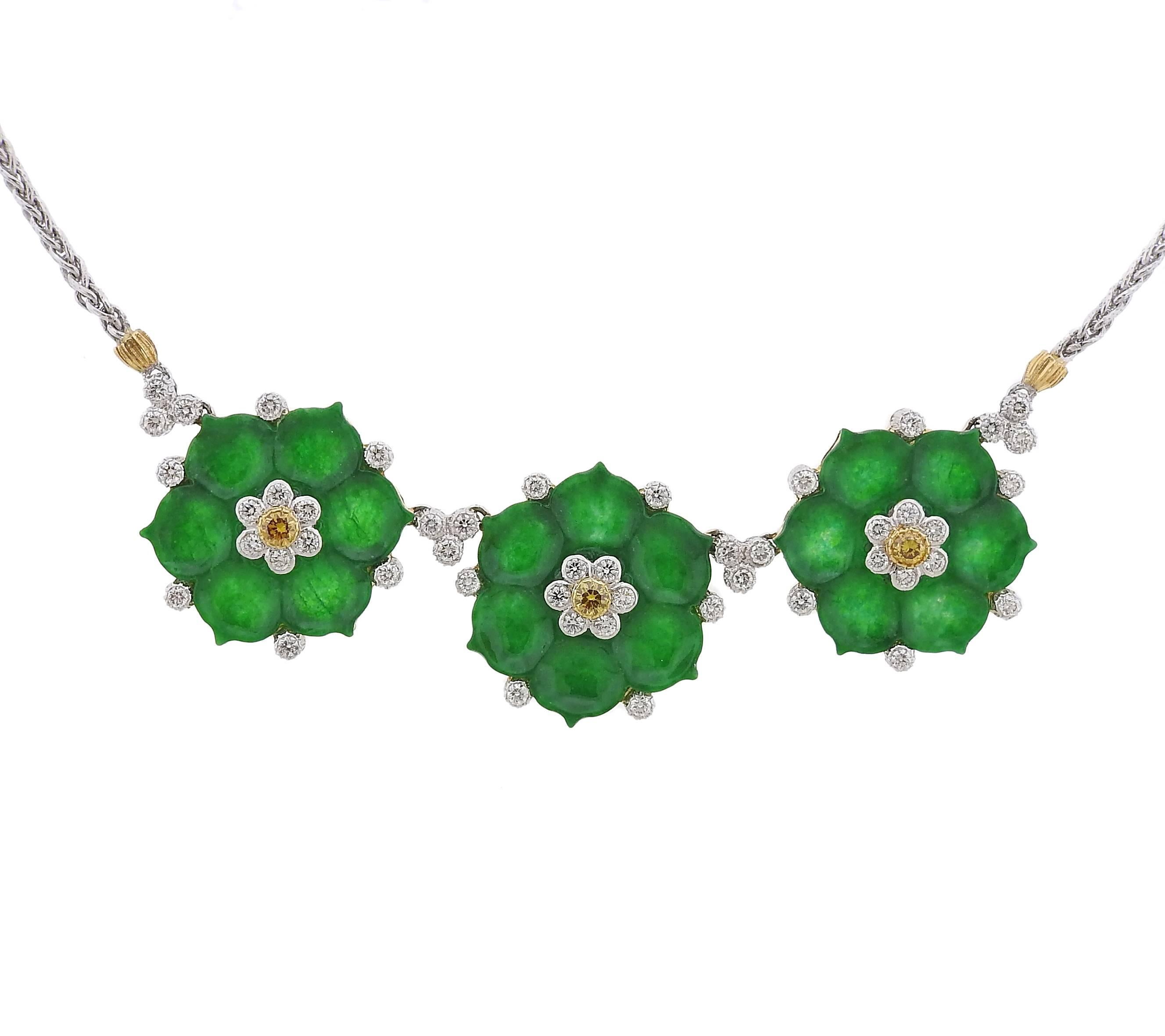 An 18k yellow and white gold necklace, crafted by Buccellati, featuring three flower pendants, decorated with carved jade and approximately 0.85ctw in diamonds. Necklace is 16 inches long, each flower measures 22mm x 24mm. Marked: Buccellati, 18k.