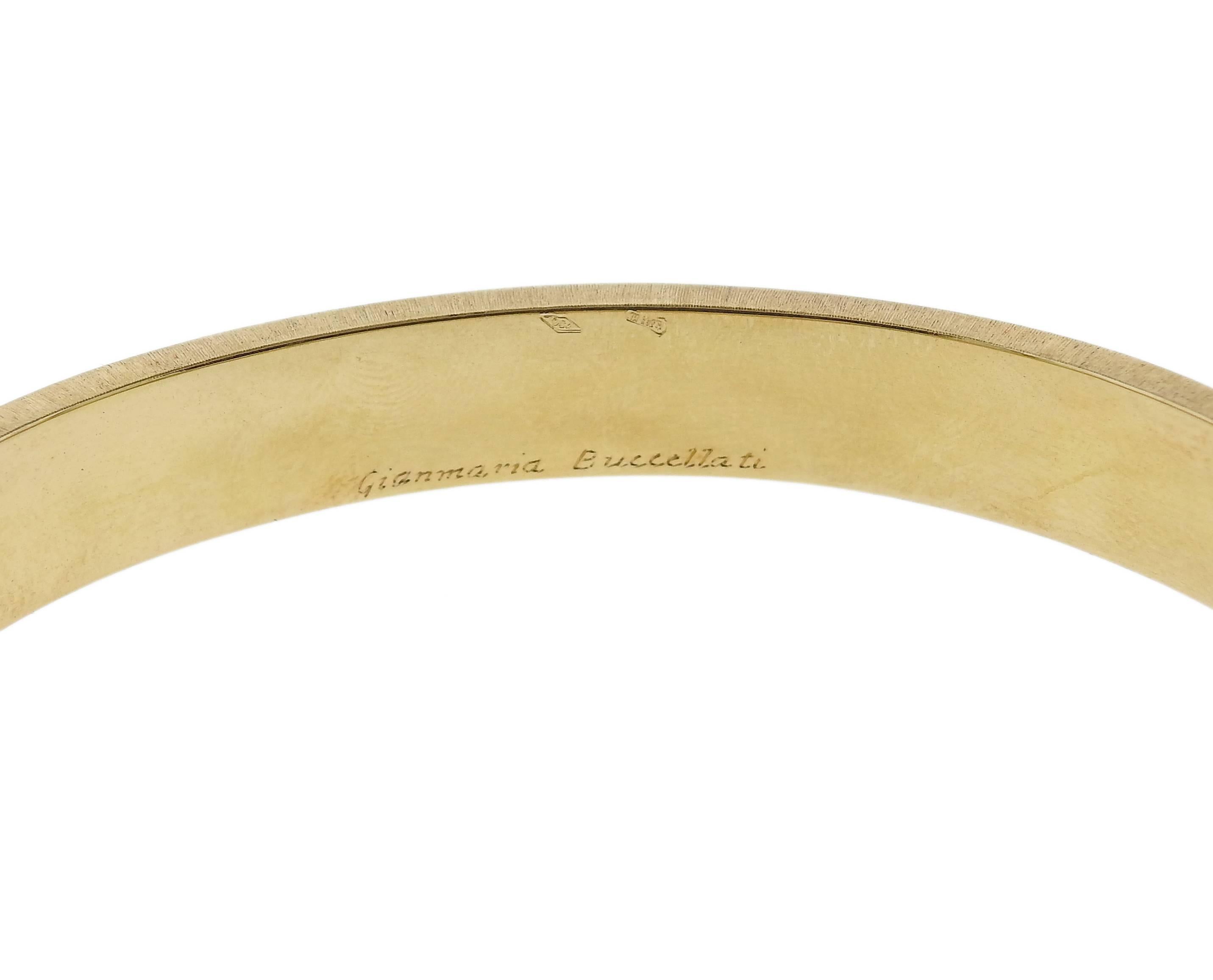 An 18k yellow gold and burnished silver leaf design bangle bracelet, crafted by Buccellati. Bracelet will fit approx. 7