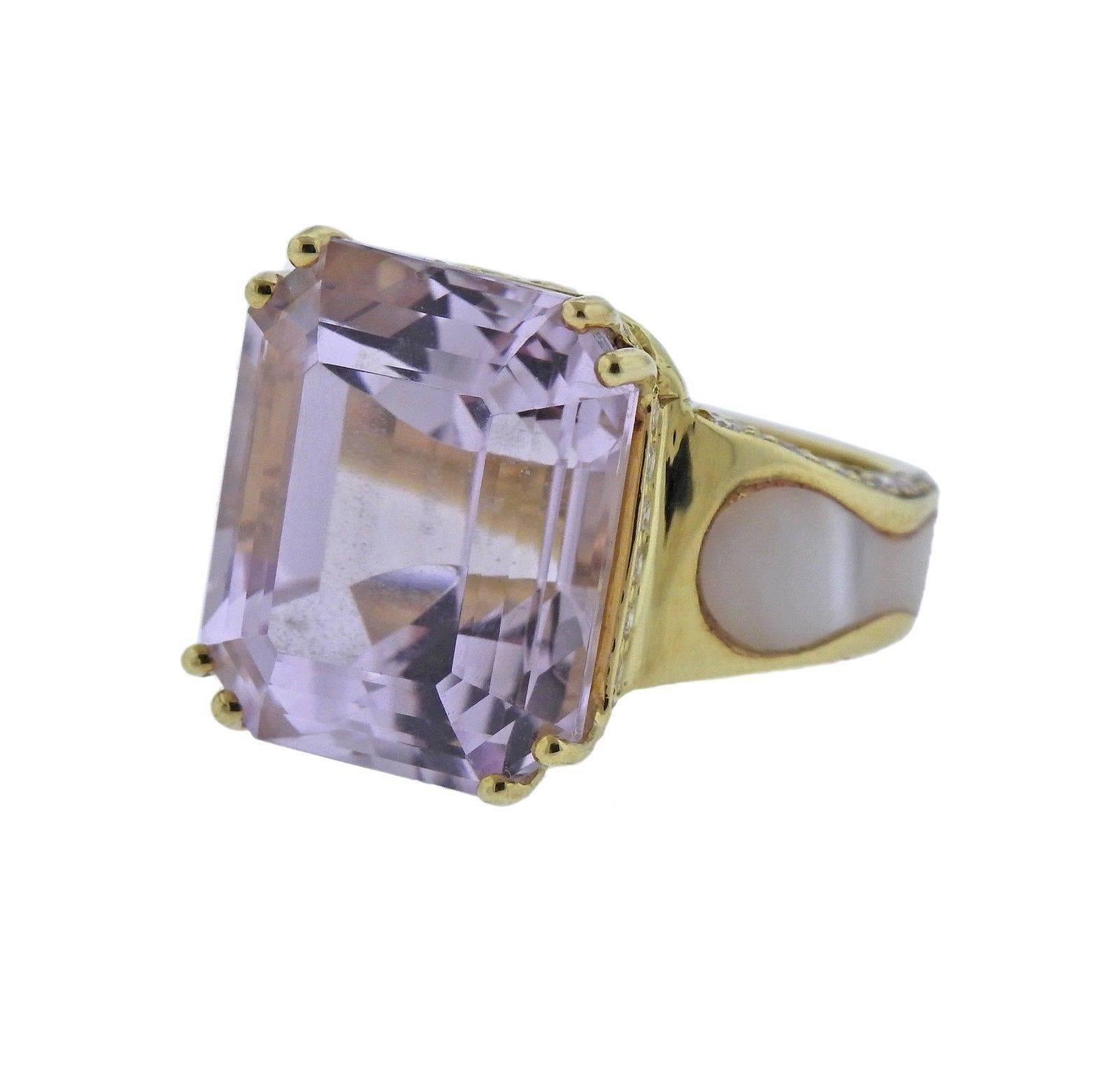 An 18k gold ring set with a 20 carat Kunzite adorned with mother-of-pearl and approximately 0.80ctw of G/VS diamonds.  The ring is a size 6 1/4 and the top measures 15mm x 18mm.  The weight of the peice is 15 grams.