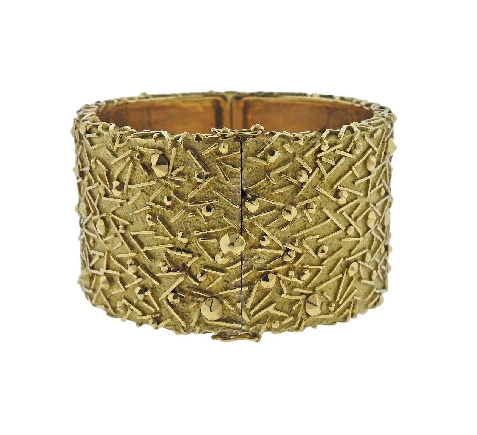 An 18k gold bracelet by Tiffany & Co.  The bracelet will fit approximately a 7