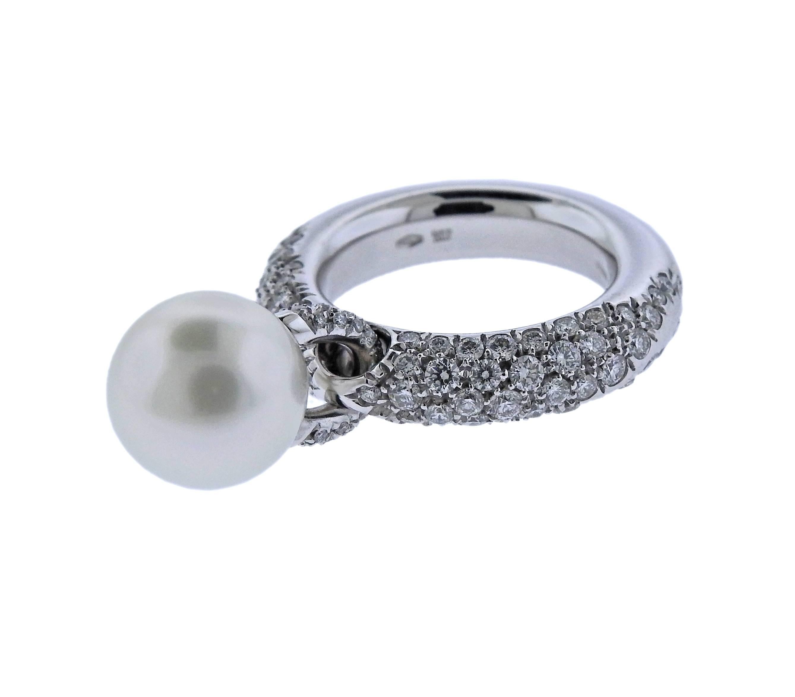 18k gold ring, crafted by Mikimoto, decorated with approx. 1.70ctw in diamonds and an 11.2mm south sea pearl . Ring size 7, shank is 5.4mm wide, weighs 18.3 grams. Marked: 750, made in Italy, 2294AI, M hallmark.