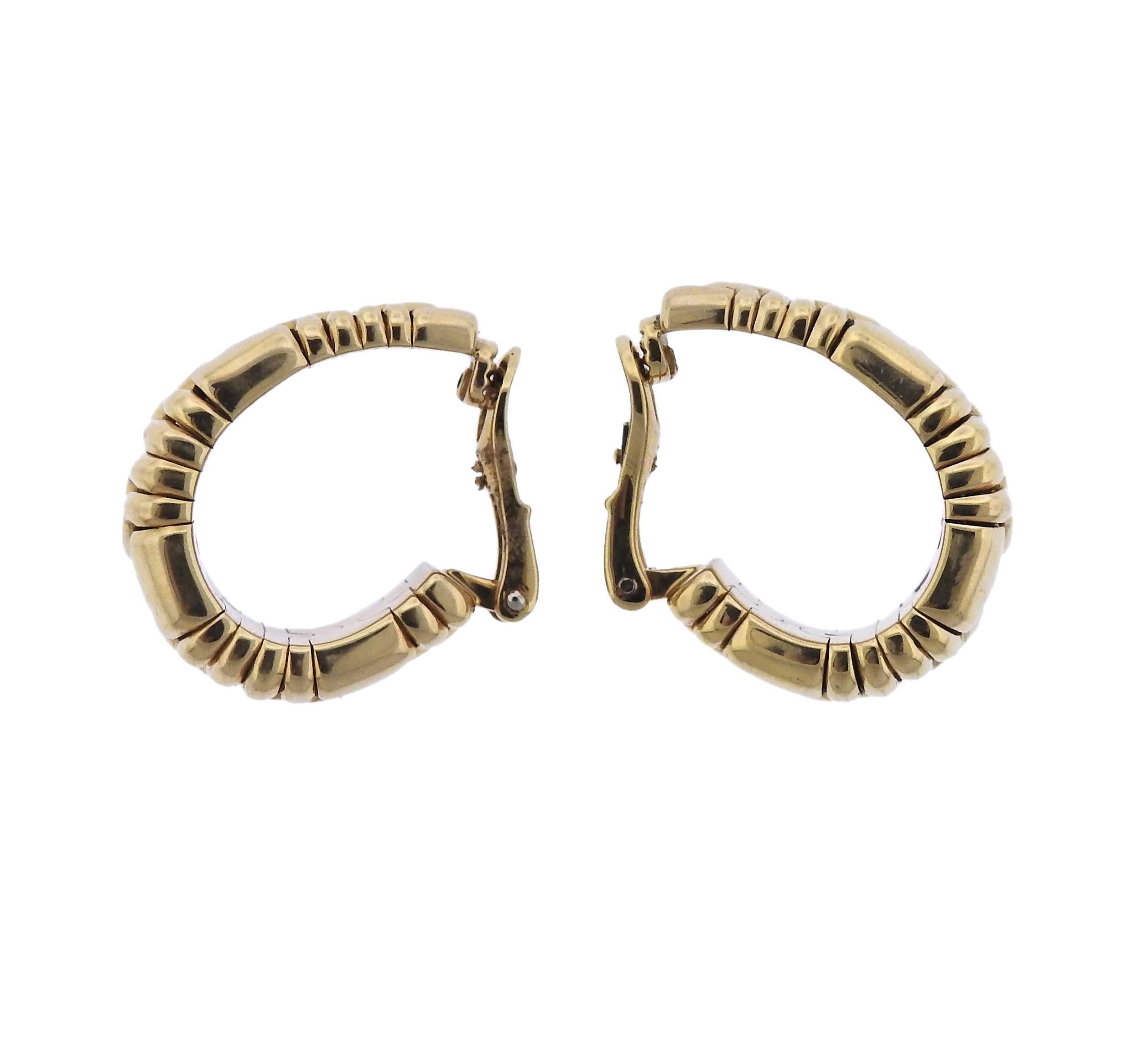 Large 18k yellow gold hoop earrings by Bulgari from Parentesi collection. Earrings measure 29mm x 14mm at widest points. Marked Bvlgari, 750, Italy.  Earrings weigh 46.8 grams. 