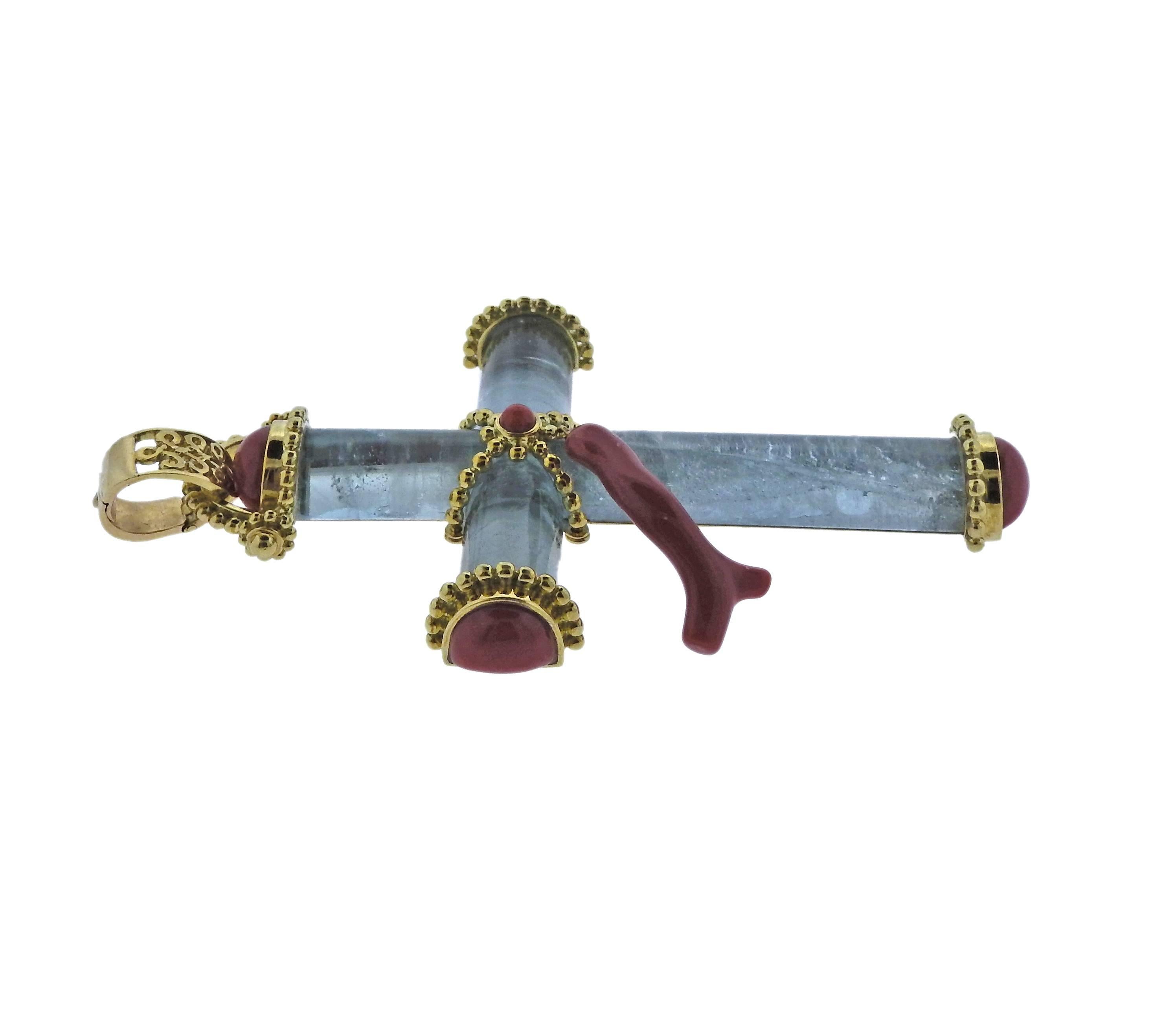 An 18k gold cross pendant crafted by Adria de Haume. Pendant features aquamarine and coral and measures 82mm x 50mm, weight is 29.6 grams. Marked Haume, Trianon mark, 36481,750. ****Pictured chain is not included, for display purposes only.