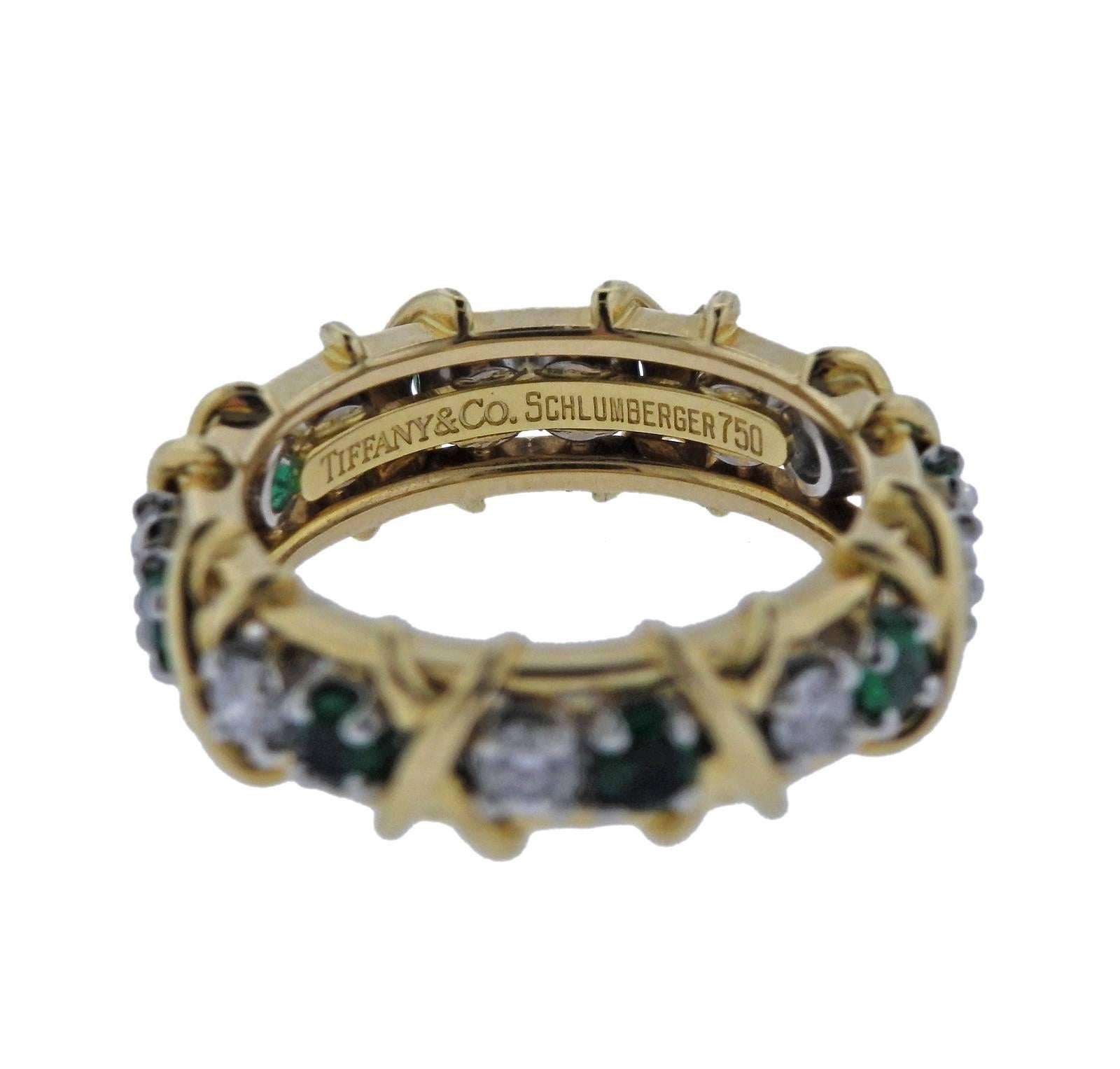 Classic sixteen stone band ring, crafted by Jean Schlumbeger for Tiffany & Co, set with 0.65ctw in diamonds and emeralds. Ring size - 6, ring is 5.3mm wide, weighs 7.9 grams. Marked: Tiffany & Co, Schlumberger 750, pt950.