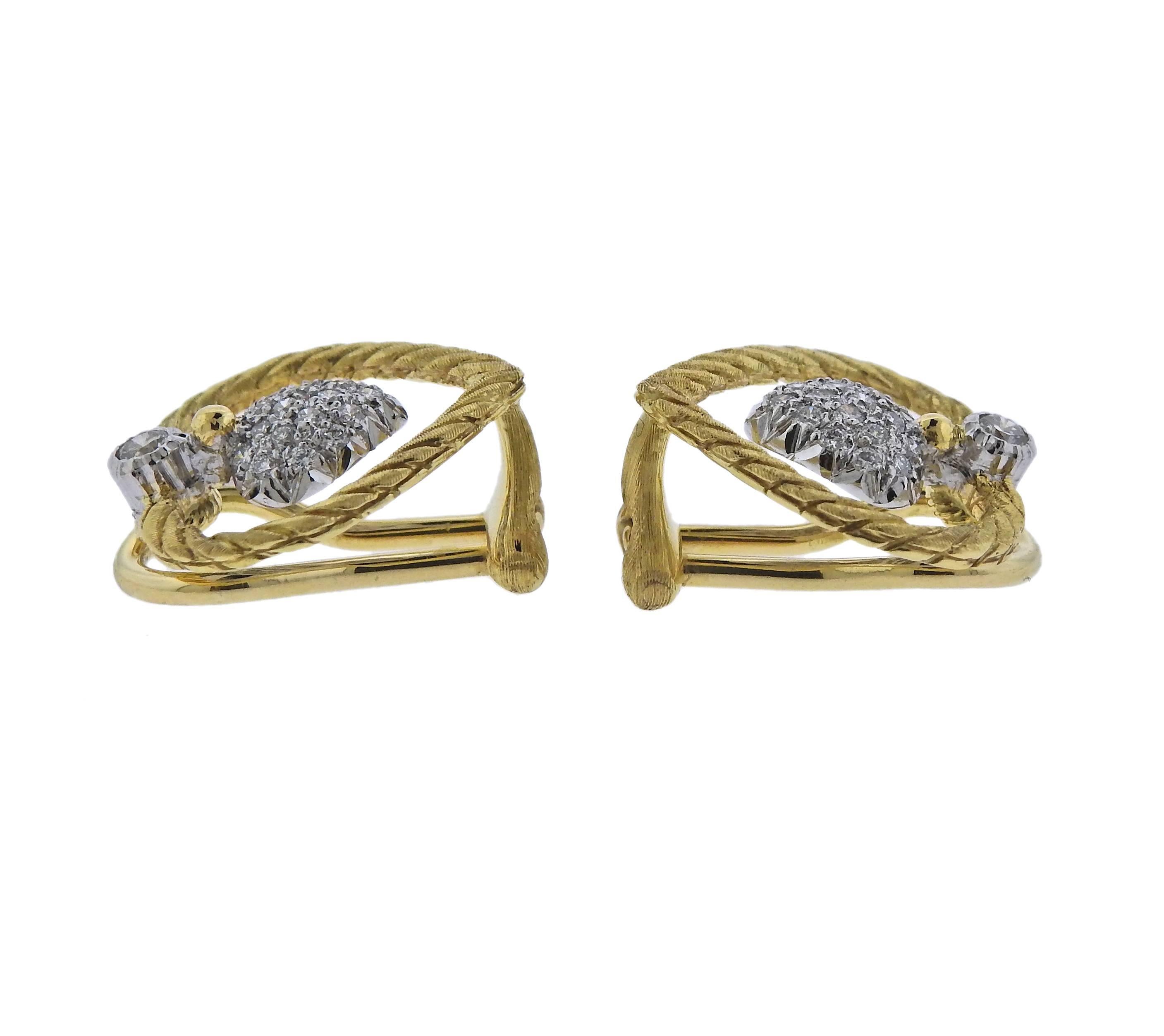 Delicate 18k white and yellow gold heart earrings, crafted by Buccellati, featuring approx. 0.30ctw in diamonds. Earrings are 18mm x 18mm, weigh 7.6 grams. Marked: 18k, Buccellati, Italy.