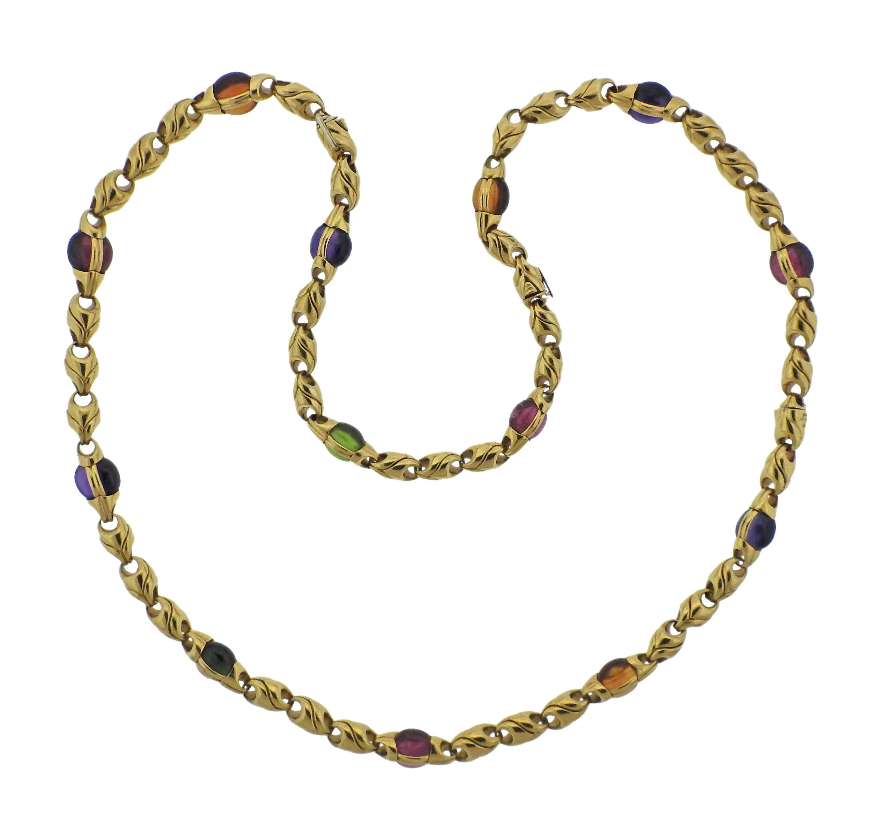  18k yellow gold necklace and bracelet suite, crafted by Bulgari, decorated with amethyst, pink green tourmaline, citrine and peridot cabochons.   Necklace is 24