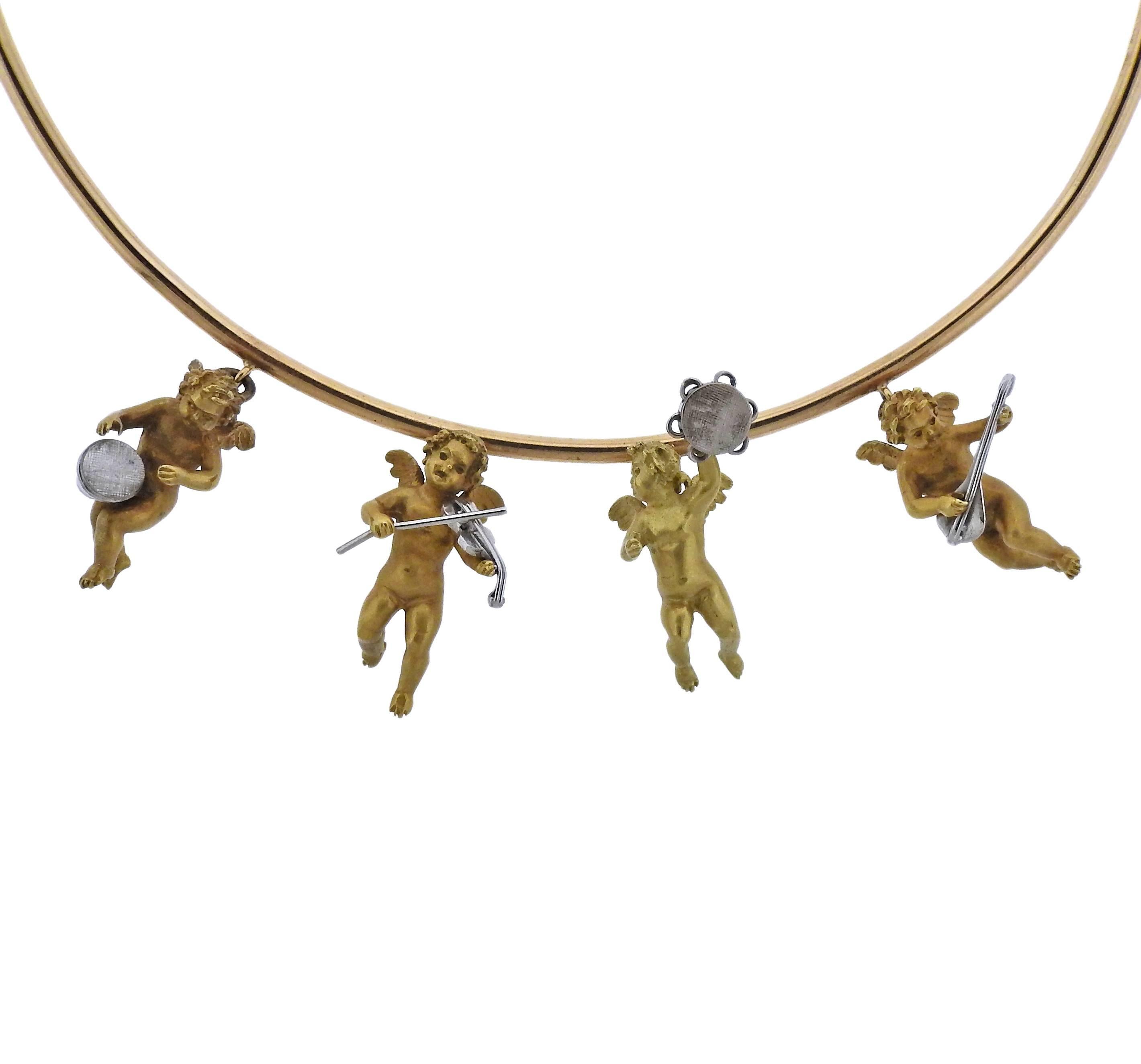  18k yellow gold necklace, featuring four cherub charms.  Inner circumference of the necklace - 14 inches,  each cherub's overall size - 25mm x 18mm. Weight of the necklace - 71.5 grams. Charms are marked 750 each.
