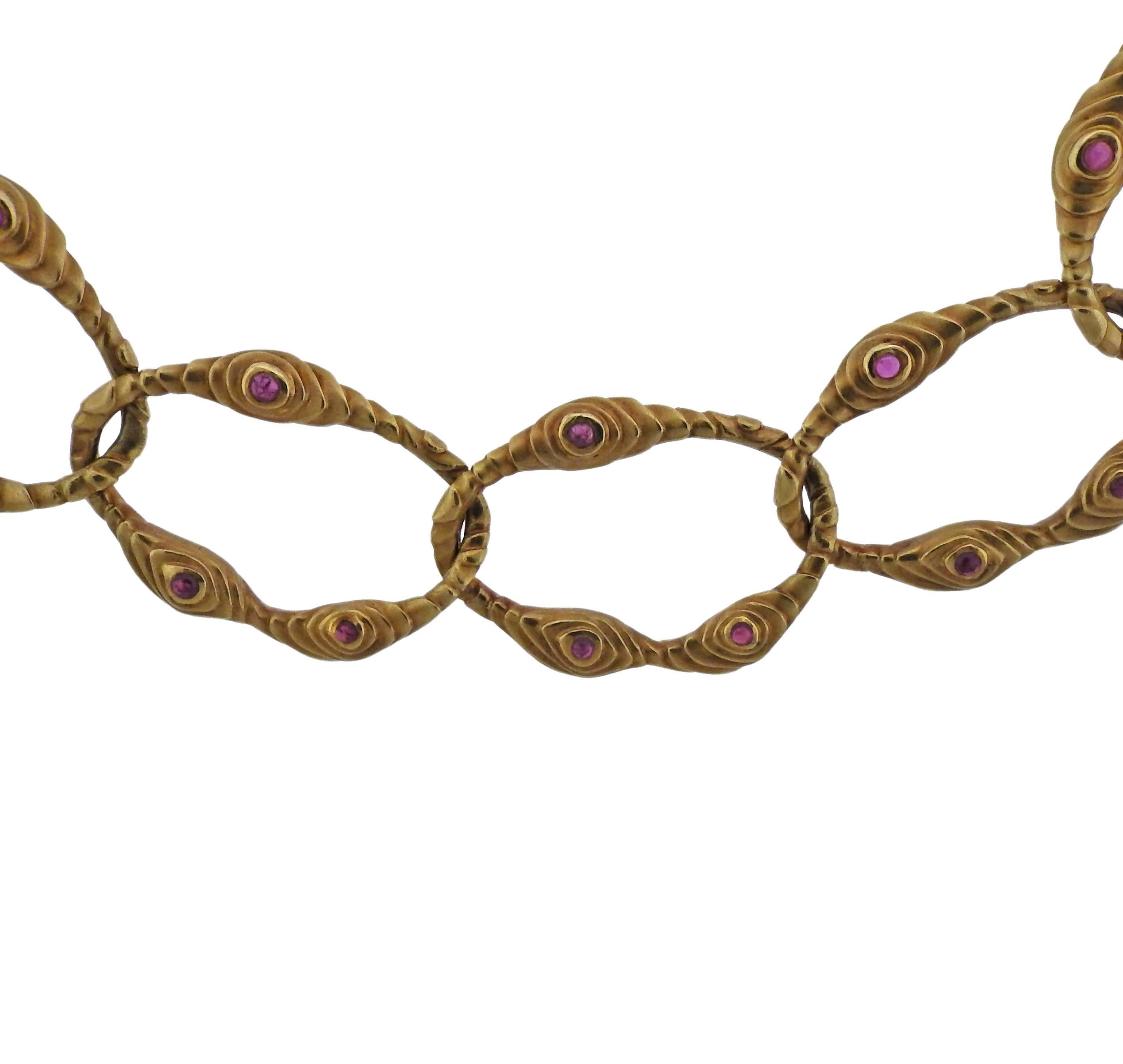 An 18k yellow gold link necklace by Angela Cummings, crafted in 1980s, decorated with ruby cabochons. Necklace is 17