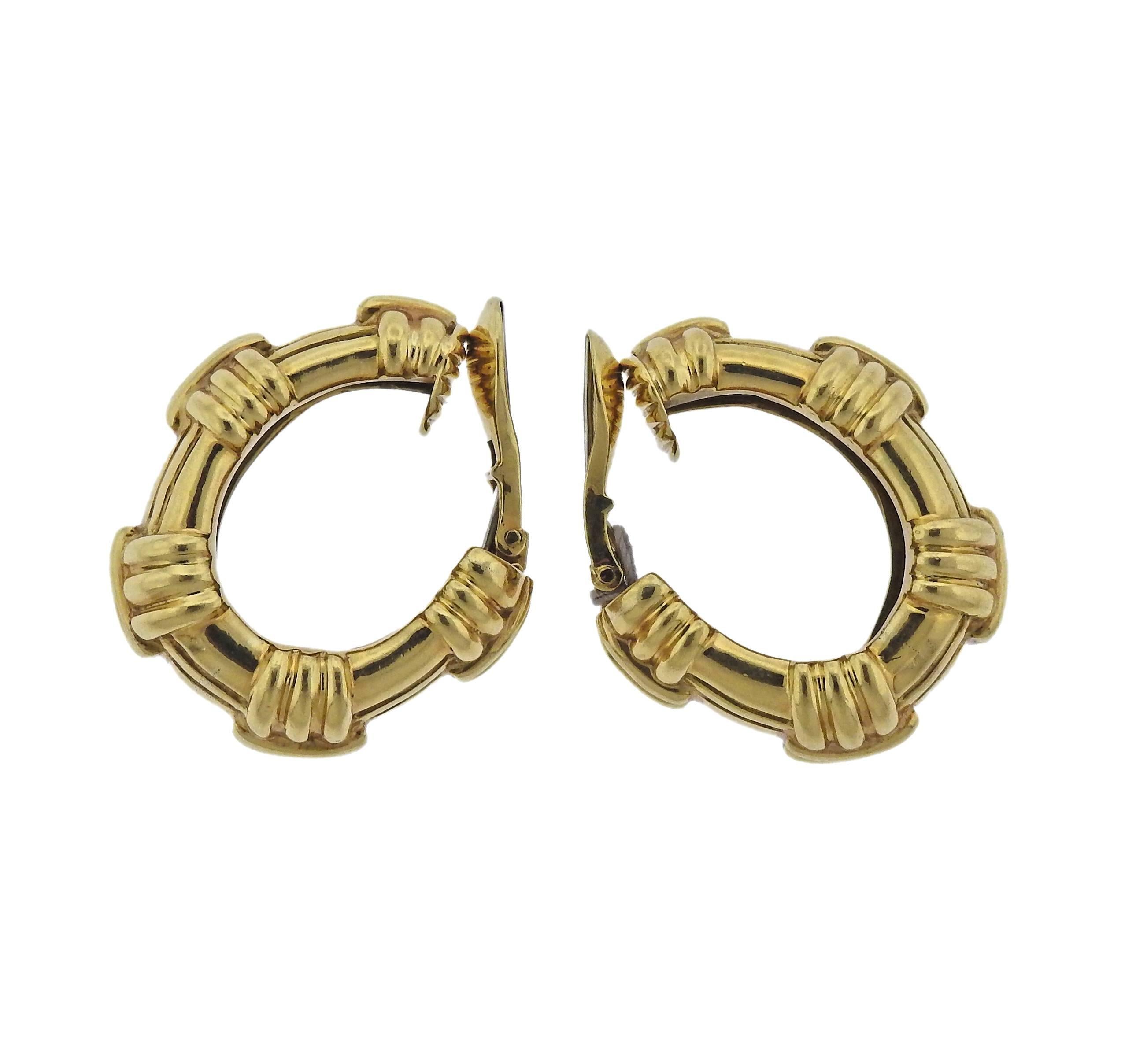 Pair of large 18k gold hoop earrings, crafted by David Webb. Earrings are 30mm x 16mm, weigh 46.7 grams. Marked: Webb, 18k. 