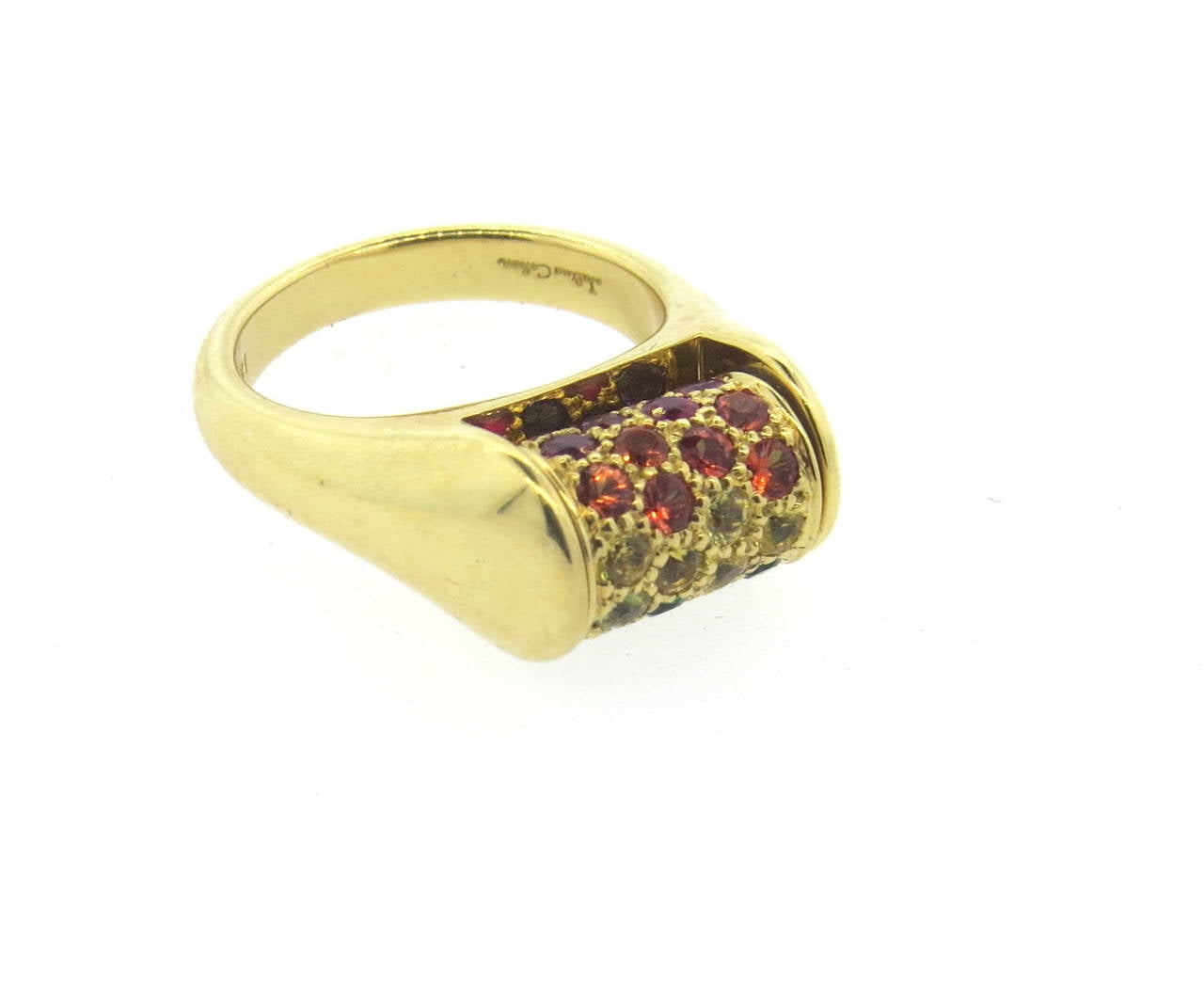 18k gold ring by Julius Cohen, featuring a rolling top, set with multicolor gemstones - sapphires, citrines, amethyst,tsavorite,ruby. Ring is a size 5, ring top is 8mm x 12mm, sits approximately 10mm from the finger. Marked 18k and Julius Cohen.
